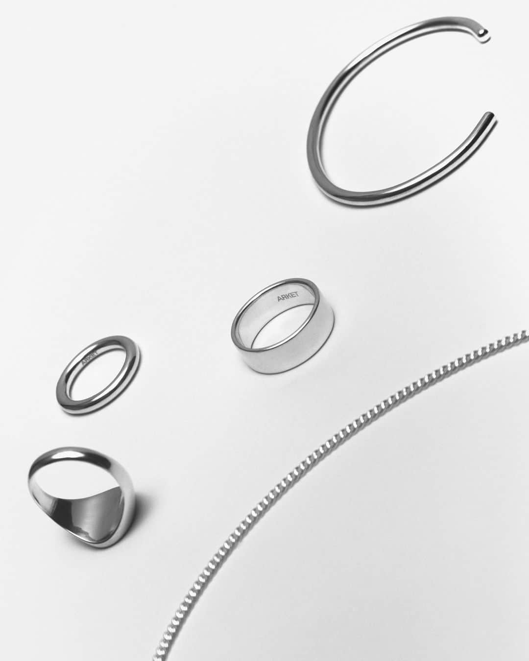 ARKETのインスタグラム：「Having reflected on the role of jewellery in the menswear wardrobe, ARKET presents a line of unadorned, austere pieces of solid recycled sterling silver. The collection bares to a minimum, proposing considered variations of the ring, the bracelet and the necklace in simple, essence-searching designs. Explore the full collection: link in bio. - #ARKET」