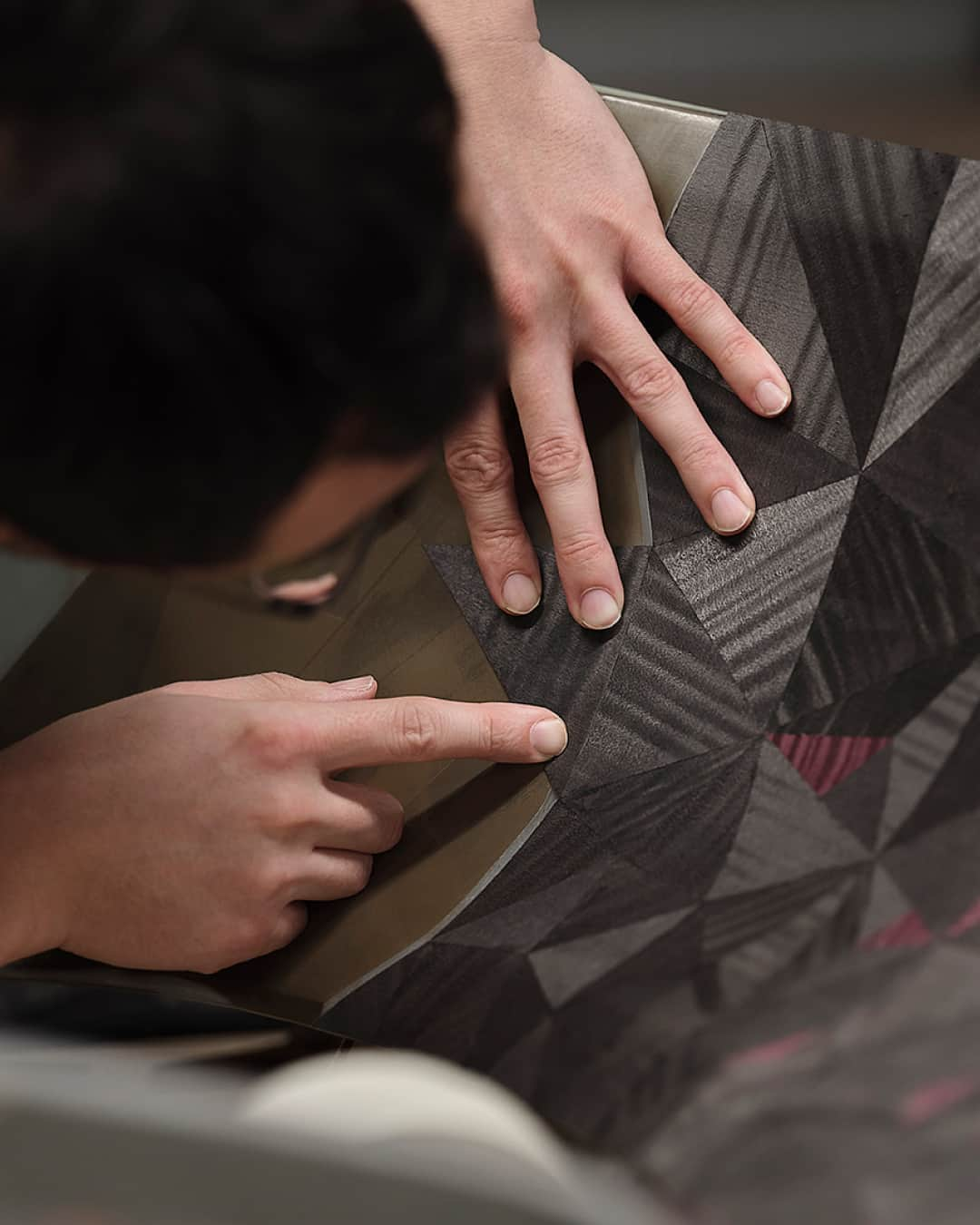 ロールス・ロイスのインスタグラム：「A singular romantic masterpiece, Rolls-Royce La Rose Noire Droptail displays an intricate parquetry artwork inspired by falling rose petals.   For weeks, the wood specialist tasked with its creation worked in a sound insulated space, mitigating the slightest chance of distraction while refining, sanding, and positioning each segment of Black Sycamore veneer.   Watch The Voice of the Maker to discover more; link in bio.   #InspiringGreatness #RollsRoyceDroptail #BespokeIsRollsRoyce #RollsRoyceCoachbuild」