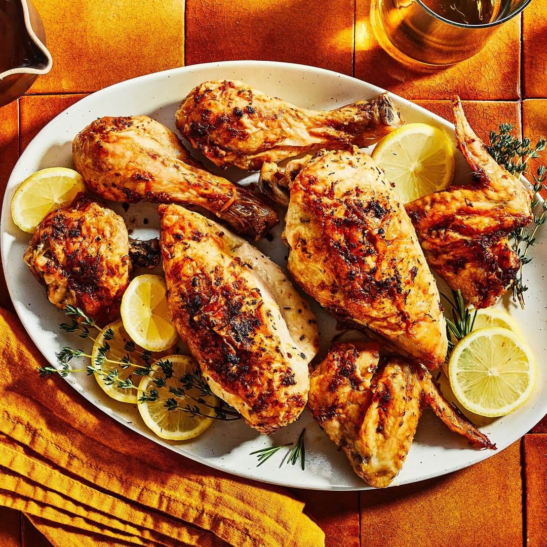 Food & Wineさんのインスタグラム写真 - (Food & WineInstagram)「Herbs, lemon, and chicken are a classic combo for a reason—they complement each other so well! What sets this Herb and Lemon Roasted Chicken recipe by @recipegoddess apart from the rest is a garlicky butter that's rubbed under the chicken skin before it cooks, yielding the crispiest exterior possible. Test the method for yourself at the link in bio. 📸: @caracormack_」11月4日 2時35分 - foodandwine