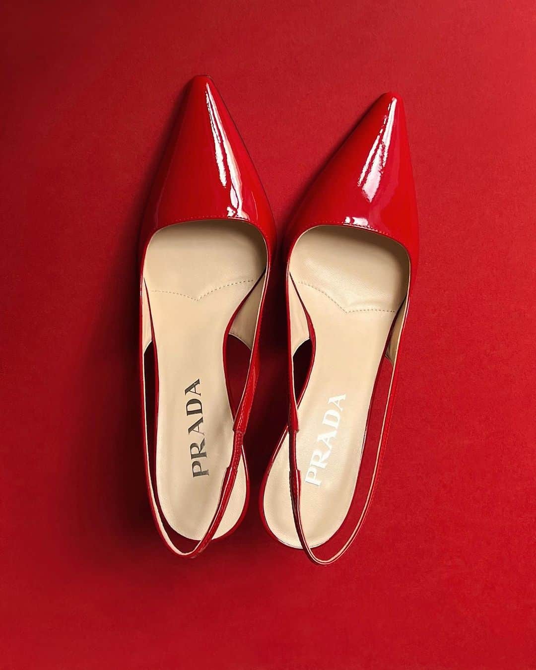 NATALIE LIAOのインスタグラム：「They say good shoes take you to good places. Well, I just found my pair of lucky red heels. I cannot wait to see the beautiful places these take mee 🥰😍. I am forever a pointed-toe silhouette lover #prada」