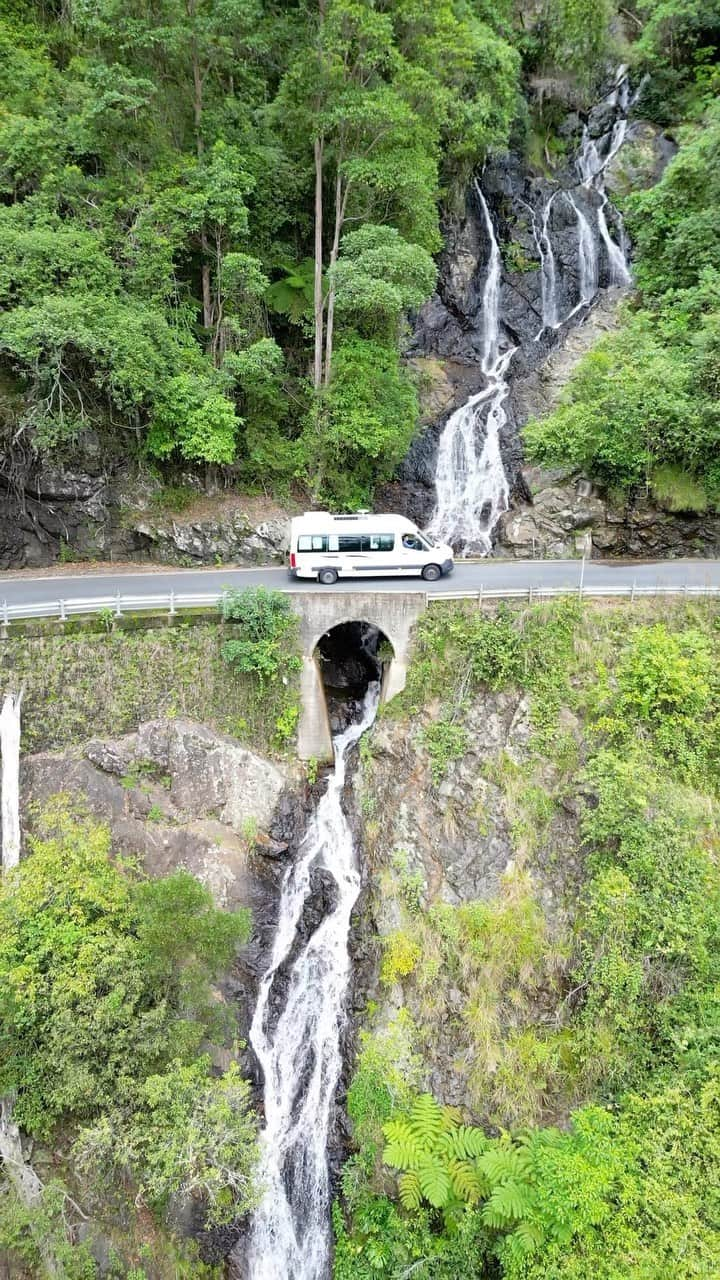 Australiaのインスタグラム：「Sorry TLC, we’ve been chasing waterfalls along @visitnsw’s #WaterfallWay 😉 If the name of this #roadtrip has you picturing rainbow-draped waterfalls and magical ferny valleys of rainforest, you’d be spot on! Starting at #CoffsHarbour, this scenic drive winds through five @nswnationalparks, lush rainforest, waterfalls, open woodlands and rolling farmlands as you approach #Armidale. You could cover Waterfall Way in about 2.5 hours, but with SO many gorgeous pitstops along the way, we highly recommend taking your time and making a day of it!   📍: Waterfall Way scenic drive, #NewSouthWales   #SeeAustralia #ComeAndSayGday #FeelNSW  ID: footage of a couple in a white camper-van travelling through a dense forest with many waterfalls and lush foliage.」