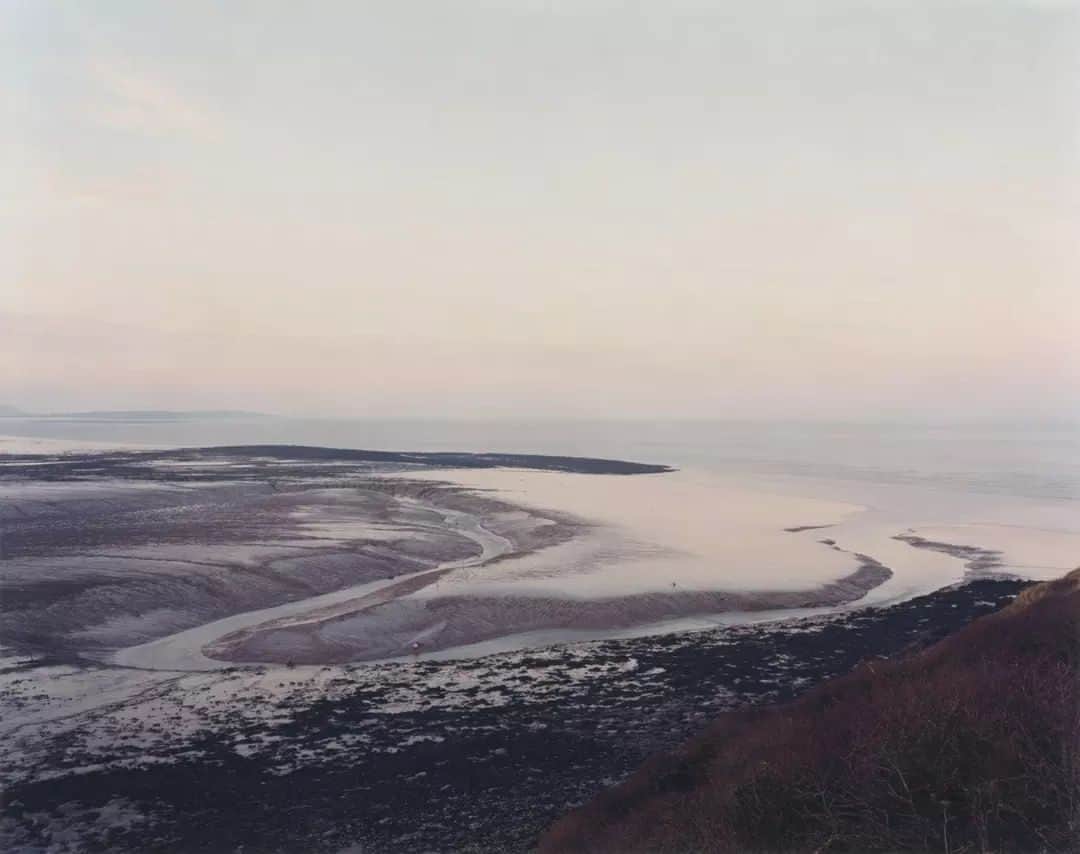 テート・ギャラリーのインスタグラム：「'Landscapes are not just physical spaces, they are imaginative spaces, and the imaginative space can be just as real.' - Jem Southam  💙  Southam’s photographs are generally the result of long, regular walks, mostly in the countryside of South West England. His first walks, in the mid-1970s, were partly inspired by the work of the land artist Richard Long (born 1945), as well as by the writing of the poet and novelist Laurie Lee (1914–1997). Since then, Southam has continued to experience the English landscape in a slow way, usually taking photographs of specific sites, which he progressively becomes attached to. His images are a response to a slow absorption and intimate knowledge of the place, a feeling of kinship with it, developed through visits and acquired knowledge, often through conversations with people who live in the area.  📷 Clevedon, Blind Yeo, 16th January 2000 📷 Senneville-sur-Fecamp, February 2006 📷 Rye Harbour, River Rother, 1 April 1999 📷 Les Petites Dalles, November 2006 📷 Brampford Speke 1998, printed 2003」