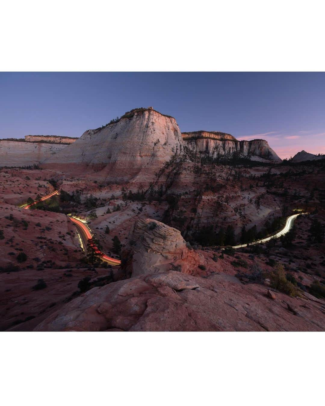 Keith Ladzinskiさんのインスタグラム写真 - (Keith LadzinskiInstagram)「Lines of traffic illuminating a windy road in Zion National Park, the 3rd most visited in the US parks system. This photo was about as unplanned as it gets, a scene I spotted as I was hiking back to the car after the sun had set. Down canyon I saw a procession of slow moving cars meandering up the road. With little time to spare I raced to a higher vantage, made a rushed composition, exposure calculation of 60 seconds and fired of one frame before the cars faded into the distance, leaving behind this parting frame here. / For @natgeo」11月5日 0時32分 - ladzinski