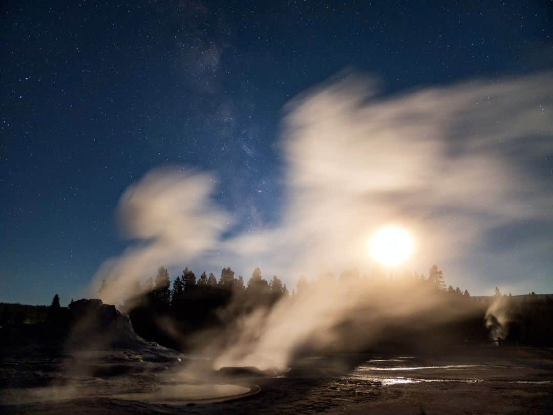 のインスタグラム：「Photos by @babaktafreshi | The setting moon and the Milky Way are seen above steaming geysers in Wyoming's Yellowstone National Park. Swipe to see more of Castle Geyser, which erupts about every 14 hours. Home to around 500 geysers, Yellowstone sits above two magma chambers that belong to a supervolcano. One chamber, about 5 km (3 mi) beneath the surface, is around 90 km (55 mi) long.」