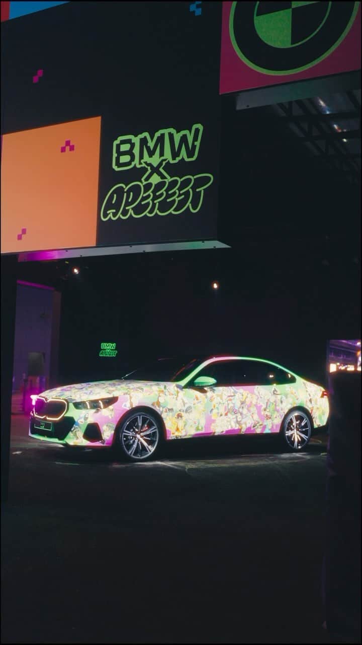 BMWのインスタグラム：「Gone Ape in Hong Kong. 🐵 The @boredapeyachtclub community and the BMW i5 came together at #ApeFest last weekend to collaboratively create the BMW “Ape Car”.  THE NEW BMW i5. 100% electric. #THENEWi5 #THEi5 #BMW #BMWi #BMWElectric #ApeFest2023 #ApeFestHK __ BMW i5 M60 xDrive Sedan: Combined power consumption: 21.2–18.2 kWh/100 km. Combined CO2 emissions: 0 g/km. Electric range: 439–516 kilometers. All data according to WLTP. Further info: www.bmw.com/disclaimer」
