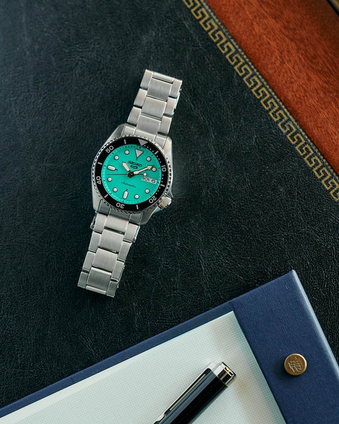 Seiko Watchesのインスタグラム：「It's Giving Teal & Stainless Steel 🟢 - Sporting a vintage style, the Seiko 5 Sports SKX Mid-Size collection has the perfect accessory to take your wrist game from simple to stunning. The vibrant green dial, framed by a black uni-directional rotating elapsed timing bezel, helps your look stand out while keeping you always on point.  #SRPK33 #Seiko #Seiko5Sports #ShowYourStyle」