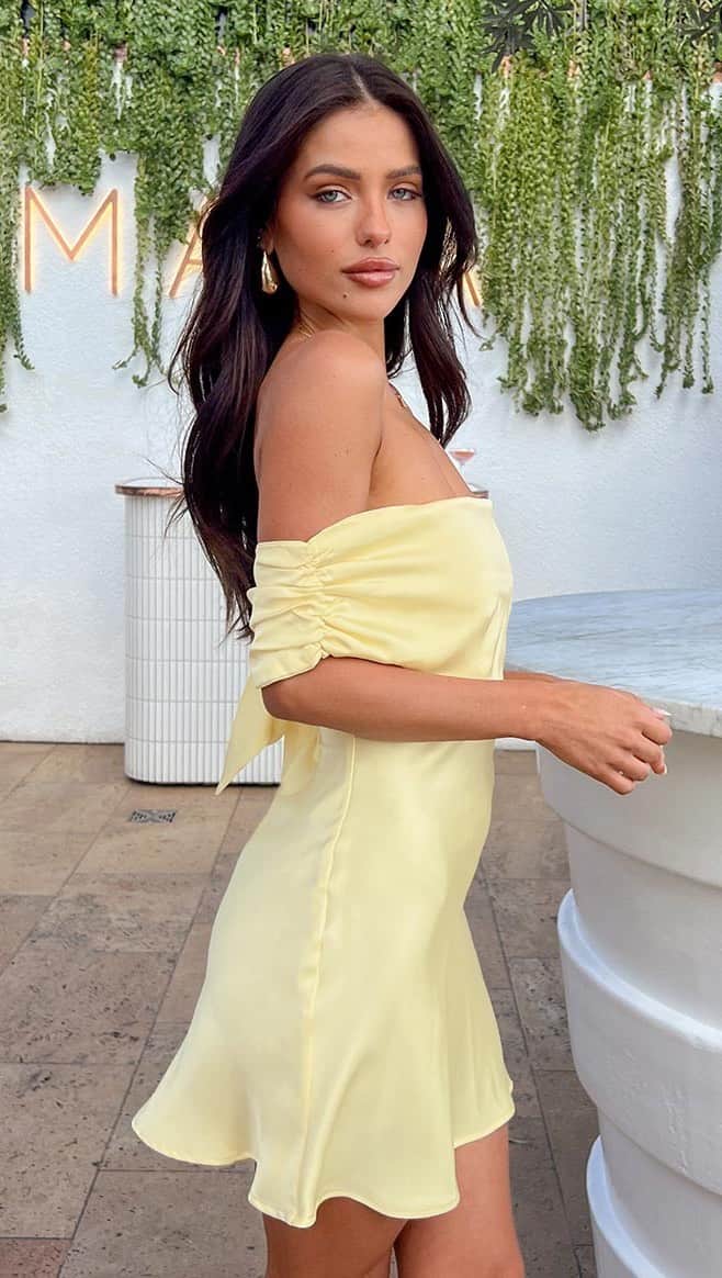 Beginning Boutiqueのインスタグラム：「The perfect little yellow mini is BACK 💛✨ Shop the RESTOCKED Primrose Yellow Satin Off the Shoulder Mini Dress, online now!」