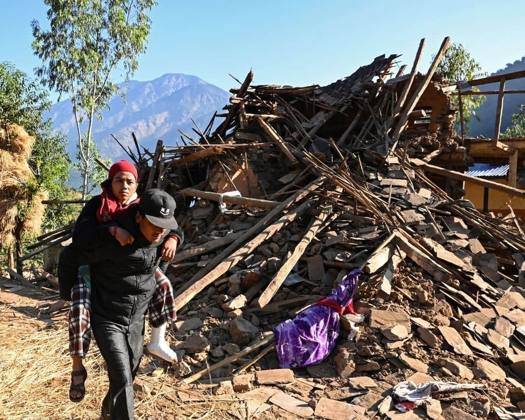 AFP通信さんのインスタグラム写真 - (AFP通信Instagram)「Search and rescue efforts after an earthquake in Nepal wrapped up on Sunday as the focus shifted to providing relief to survivors awaiting food and shelter, officials said 36 hours after the disaster struck.⁣ ⁣ At least 157 people were killed in isolated western districts of the Himalayan country when the 5.6-magnitude earthquake hit late Friday.⁣ ⁣ Many survivors spent the night under the open sky, their mud houses reduced to piles of rubble.⁣ ⁣ 1-> 5 - Survivors search for belongings through the ruins of their damaged houses in Khalanga, in Jajarkot district.⁣ ⁣ 6 - A wounded survivor is helped in Chiuri village in Chiuri village at Jajarkot district.⁣ ⁣ 7 - Survivors rest under an open sky near a damaged house, Rukum district.⁣ ⁣ 8 - Survivors  sit in front of a damaged house in Chiuri village at Jajarkot district.⁣ ⁣ 9 - A woman mourns the loss of her grandson in Chiuri village at Jajarkot district.⁣ ⁣ 10 - Family members and villagers gather around the bodies of earthquake victims before a mass cremation ceremony in Chiuri village at Jajarkot district.⁣ ⁣ 📷 @prakash_afp⁣ 📷 @prabin_ranabhat⁣ ⁣ #AFPPhoto」11月6日 21時01分 - afpphoto