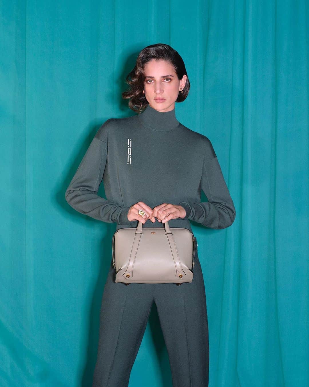 Fendiのインスタグラム：「A new everyday. A classic silhouette of the Maison is reimagined in the Fendi Boston 365 bag.  Curated with: @stefanopilati  Artistic Director of Couture and Womenswear: @mrkimjones  Artistic Director of Accessories and Menswear: @silviaventurinifendi  Artistic Director of Jewellery: @delfinadelettrez  Styling: @elliegracecumming Hair: @jawaraw Makeup: @hannah_murray1  Casting: @shelleydurkancasting Model: Rachel Marx  Photography: @johnnydufort  Set Design: @maxbellhouse」