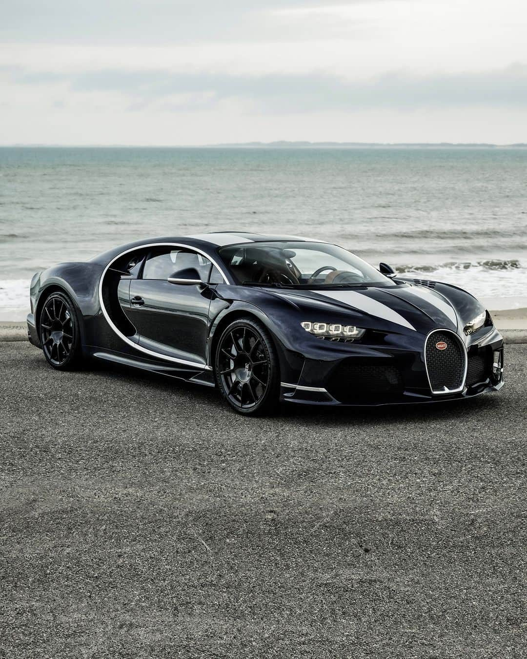 ブガッティのインスタグラム：「Lovingly co-created with a Belgian client, whose family-run business like the BUGATTI brand is steeped in a rich heritage that extends beyond 100 years, this CHIRON Super Sport is immersed in excellence.   The BUGATTI team welcomed the customer on several occasions to the brand’s headquarters in Molsheim, working hand-in-hand as they embarked upon a journey from configuration to completion, in the process bringing to life a customer’s very own CHIRON Super Sport vision. During his visits, the @BUGATTIBrussels client witnessed the signing of the monocoque, along with his family; the marriage of the  engine and monocoque and the final dynamic approval drive together with the BUGATTI quality team.  Following a seamless and successful handover, the customer drove his CHIRON Super Sport home from Molsheim – where it forms the centerpiece of the family’s automotive collection.  #BUGATTI #CHIRONSuperSport #BUGATTIBrussels – WLTP: bugatti.link/consumption」