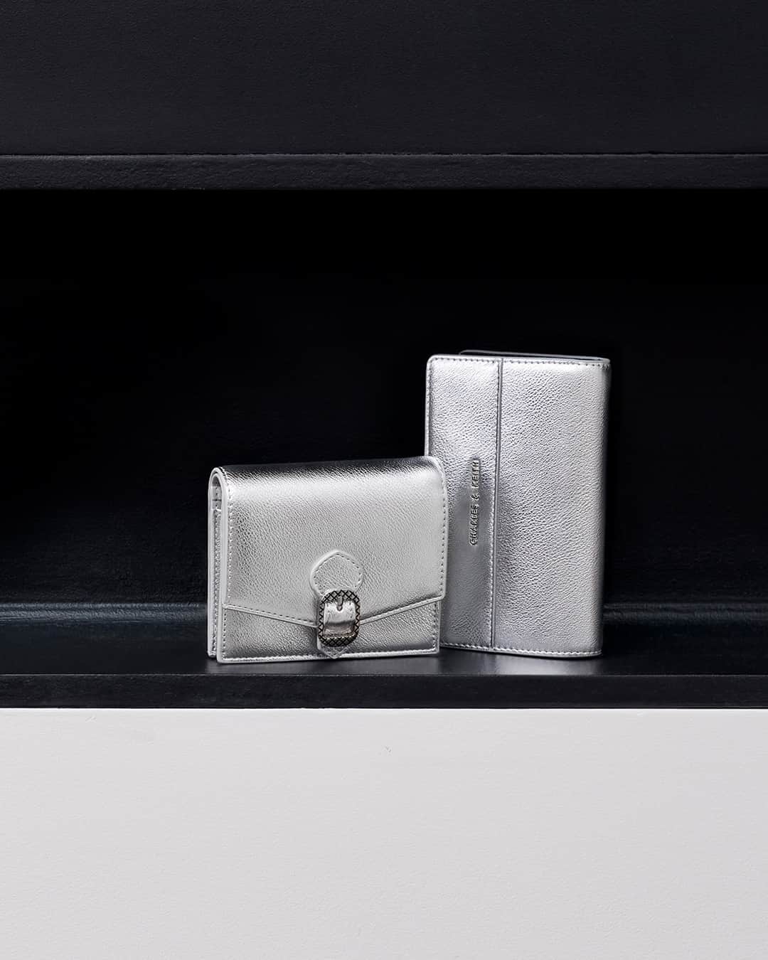 CHARLES & KEITHのインスタグラム：「CHARLES & KEITH HOLIDAYS GIFTS  This festive season, show your appreciation for stylish loved ones with these glamorous silver-toned wallets — small but striking, they make for fabulous stocking stuffers.  Discover more via the link in bio.  #CharlesKeithCelebrates #CharlesKeithFW23 #CharlesKeithOfficial  Product featured:  Avis Metallic Printed-Buckle Wallet Metallic Top-Zip Short Wallet」