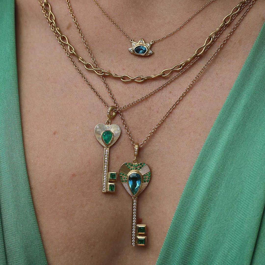 のインスタグラム：「Opening up the heart with hand engraved, forged gold, gemstone and diamond pave Key Necklaces. 🗝️💚💙#keytoyourheart #onlyone #emerald #tourmaline #heirlooms #brookegregson」