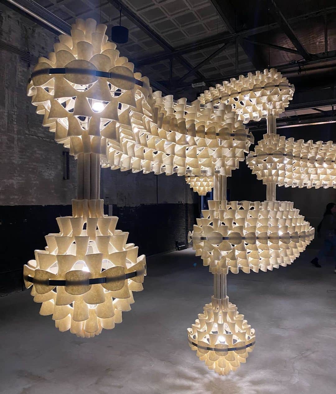 Design Milkのインスタグラム：「We got to explore @dutchdesignweek + we're kicking off our rundown with a show curated by Annemoon Geurts called Evolving Harmony: Intertwining Hope and Design.  The show took place in @kazerneehv, a 2,500-square-meter space that was a former military police barracks. From captivating sculptural pieces, like @grietjeschepers' Ellipt 007 casting mesmerizing patterns with Dutch wool felt, to exploring the secrets of lac bugs in @ori_orisun's "Made by Insects," which reveals fresh ways to work with natural polymers -- every installation left us in awe! \\\ Come see more at the link in bio. 🔗」
