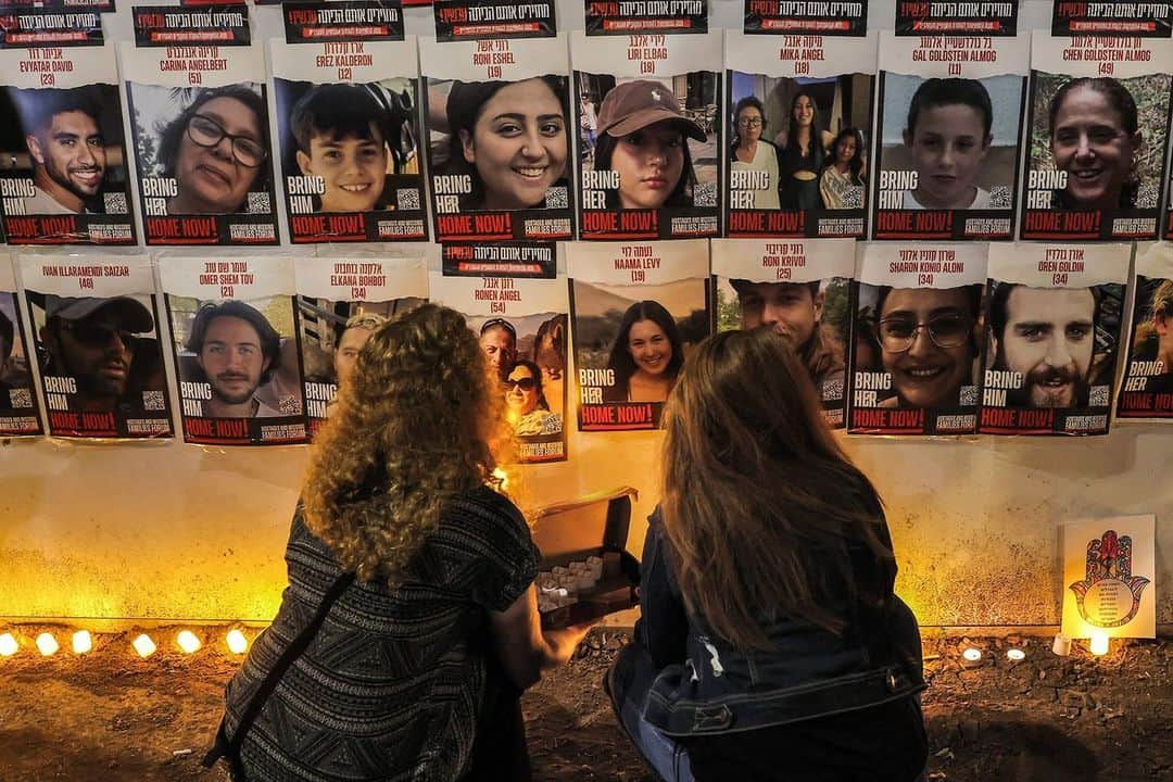 TIME Magazineのインスタグラム：「One month after the Oct. 7 Hamas attack that killed 1,400 people, Israelis gathered to take part in vigils across the country.  Attendees remembered the victims and prayed for the release of the hostages.  Photographs by Ahmad Gharabli—AFP/Getty Images, Marcus Yam—Los Angeles Times/Getty Images, Leo Correa—AP」