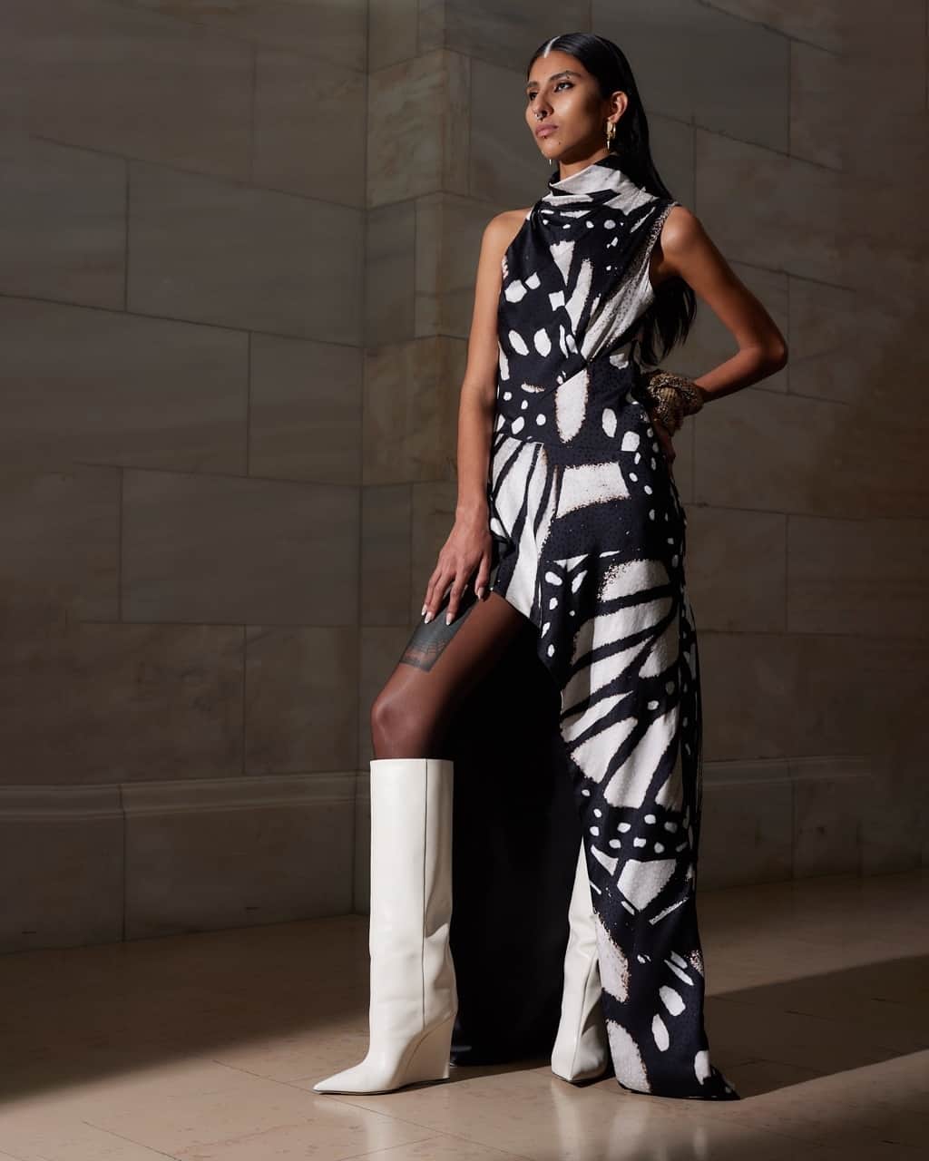 プラバルグルンのインスタグラム：「Artful Asymmetry⁠ ⁠ Black and Ivory Butterfly Printed High Neck Sleeveless Asymmetric Hem Dress from the Fall Winter 2023 collection⁠ ⁠ Photo by @egandrew」