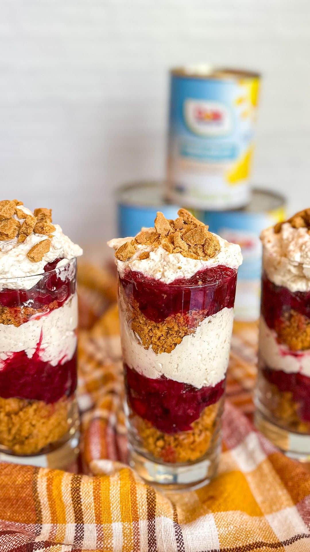 Dole Packaged Foods（ドール）のインスタグラム：「#sponsored Pumpkin Trifle with Pineapple Cranberry Compote. The perfect holiday dessert made with @dolesunshine Crushed Pineapple!🍍  Ingredients:  For the cake: 1 box spice cake mix (15.25 oz) 15 oz canned pumpkin puree 3 large eggs  For the compote: 20 oz can Dole Crushed Pineapple 12 oz fresh cranberries ⅓ cup granulated sugar  For the cream: 1 ½ cups heavy whipping cream 8 oz cream cheese, softened 1 cup granulated sugar 1 teaspoon vanilla extract 1 teaspoon pumpkin pie spice ⅛ teaspoon salt ¾ cup crushed gingersnap cookies  Directions: Preheat oven to 350 degrees F. Grease a 9x13 baking dish by spraying with baking spray.  In a large bowl, using a hand mixer or whisk, mix together cake mix, pumpkin puree, and eggs. Stir until well combined then pour into prepared dish. Bake 25-30 minutes or until a toothpick inserted comes out clean. Let cool completely then cut cake until small squares (while in dish) then set aside.  In a small bowl, beat heavy whipping cream until stiff peaks form. Set aside. In a larger bowl or stand mixer, beat cream cheese, sugar, vanilla, pumpkin pie spice and salt until smooth. Fold whipped cream into the cream cheese mixture until well combined. Set in fridge until ready to use.  In a medium saucepan over medium high heat, add cranberries, pineapple, and sugar. Stir and cook until mixture comes to a low boil. Continue cooking until slightly thickened, about 10 minutes. Set aside to cool completely. Place in fridge until ready to assemble trifle.  In a trifle bowl or large glass bowl, layer 1/3 of the cake cubes and crumbles, 1/3 pineapple cranberry compote, and 1/3 cream filling. Repeat two more times ending in cream. Top with crushed cookies.  Refrigerate at least 3 hours before serving.  Note: Can also be made in individual clear glasses.  #DoleSunshine #CanItPineapple」