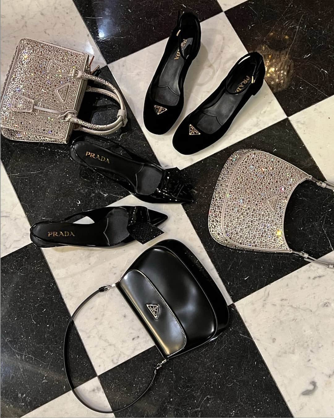 Harrodsのインスタグラム：「#Prada, but make it party 🪩 The brand’s iconic bags and footwear favourites get a high-shine upgrade for the festive season in crystal-embellished satin and patent leather.  Find them in Luxury Accessories on the Ground Floor and Shoe Heaven on the Fifth Floor.  #Harrods #HarrodsFashion」