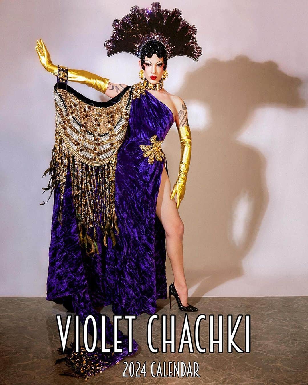 ヴァイオレット・チャチキのインスタグラム：「My 2024 calendar is now available for purchase! Enjoy 14 never before seen images. This years calendar documents some of my most iconic costumes ever. Many of which have been around the world and are now being  archived never to be seen again! The cover image look I’ve chose is especially significant to me because it was designed by Fabio Zambernardi who just this last September stepped down from his iconic role at Prada. The calendar was shot by my friend @latexluciferrr and is 8.5 X 11 inches and pre hole-punched ready to be hung! 💜available via the link in my bio」