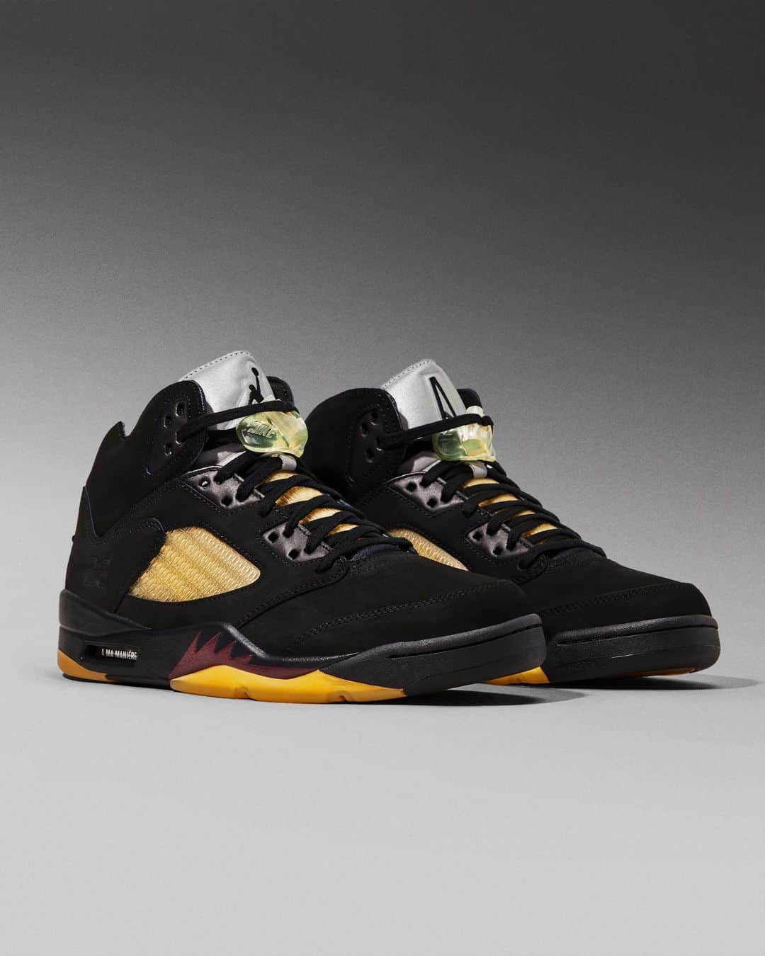 Flight Clubのインスタグラム：「Nike's storied partnership with A Ma Maniére resumes. Part of a two-piece collaboration, the Air Jordan 5 Retro 'Dusk' arrives in a stealthy blacked-out nubuck upper with elegant Burgundy and Gold hits. The Atlanta boutique's signature 'A' logo forms a pattern on the quarter panel. A pre-yellowed outsole supplies the vintage touch.」