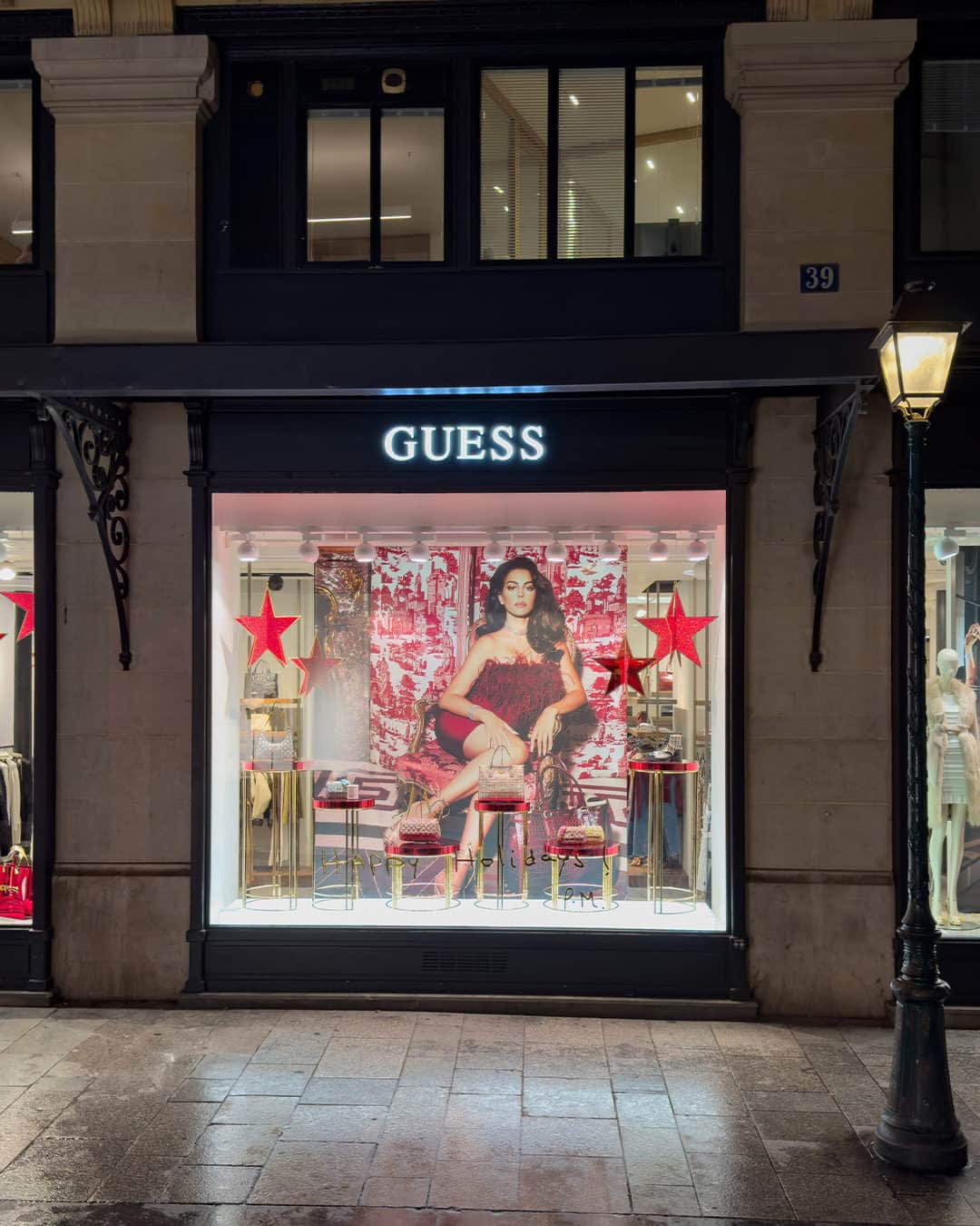 ゲスのインスタグラム：「Joyeuses fêtes from the iconic store front on Étienne Marcel in Paris. Discover the GUESS store experience this holiday season.」