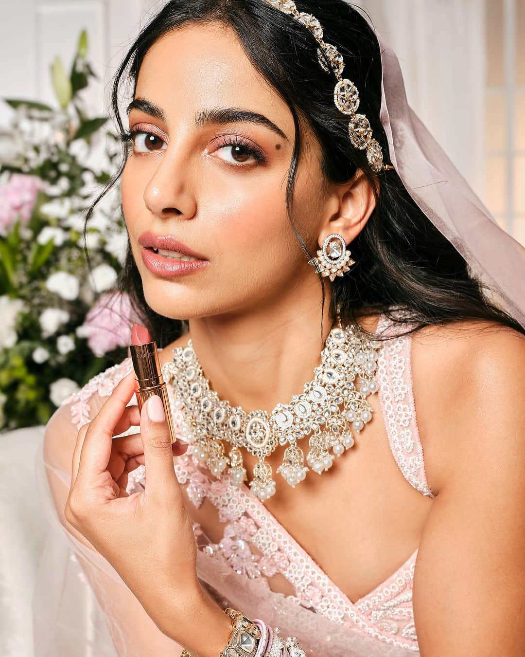 Banita Sandhuのインスタグラム：「All eyes are on @charlottetilbury’s Dreamy Pillow Talk Wedding Look featuring @banitasandhu & created by celebrity makeup artist @tanvichemburkar ✨  The look is all about natural beauty AMPLIFIED with luminous complexion, rose-gold eyes & love- blushed cheeks🤩  And the secret to her dreamy nude-pink lips? The ICONIC Matte Revolution Lipstick in Pillow Talk Medium, adored by brides all over the world 💋  #Nykaa #CharlotteTilburyXNykaa #OnlyAtNykaa #BridalLook #BridalMakeup #WeddingMakeup #PillowTalk #CharlotteTilburyBride」