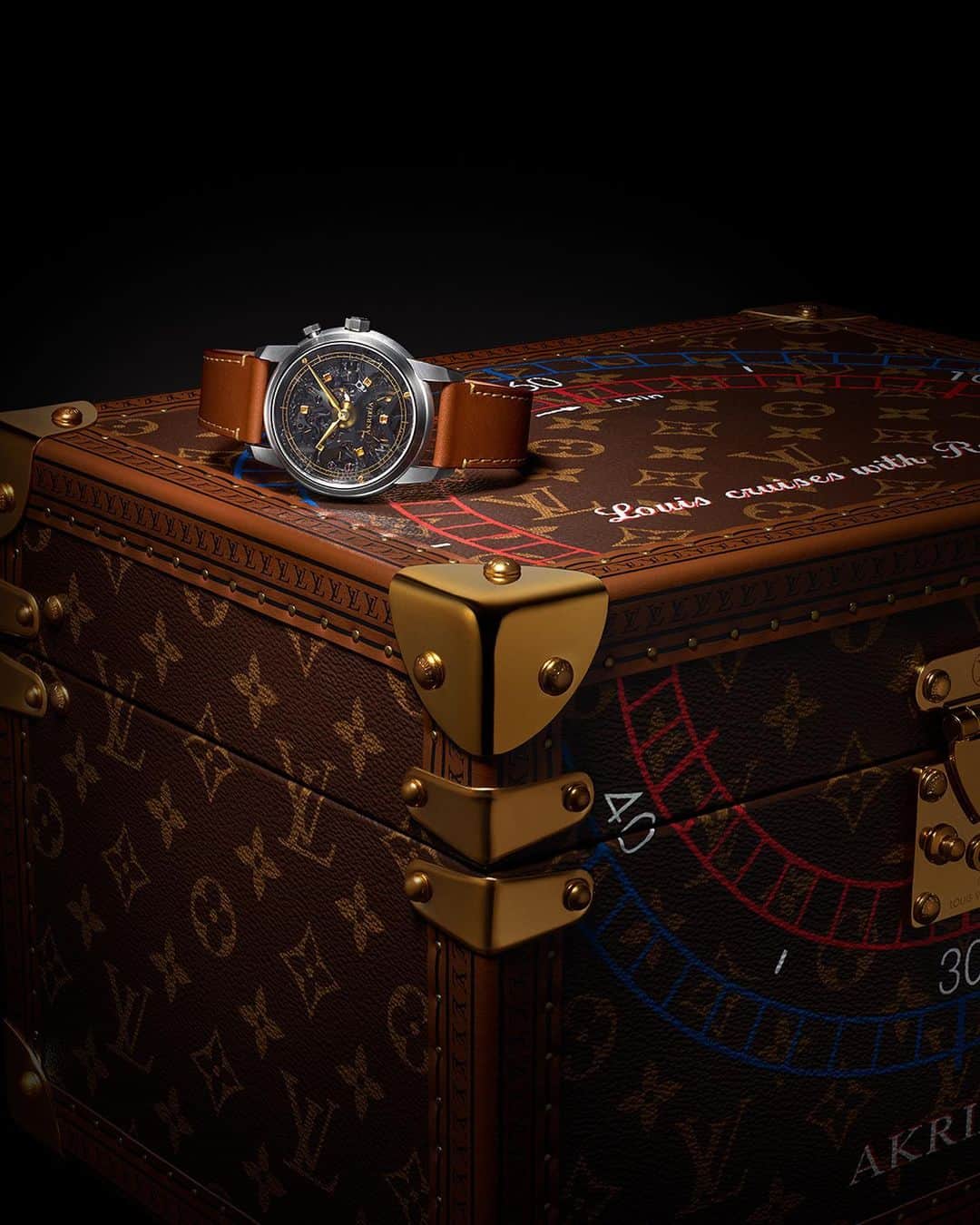 ルイ・ヴィトンのインスタグラム：「Louis Vuitton x AKRIVIA. Reminiscent of Louis Vuitton's traveling heritage, the LVRR-01 watch is accompanied by a bespoke hand-painted trunk with a motif inspired by the chronograph scales, seen on the dial’s enamel design. Discover the limited edition creation via link in bio.   #Akrivia #RexhepRexhepi #LVHighWatchmaking #LaFabriqueDuTemps #LouisVuitton」