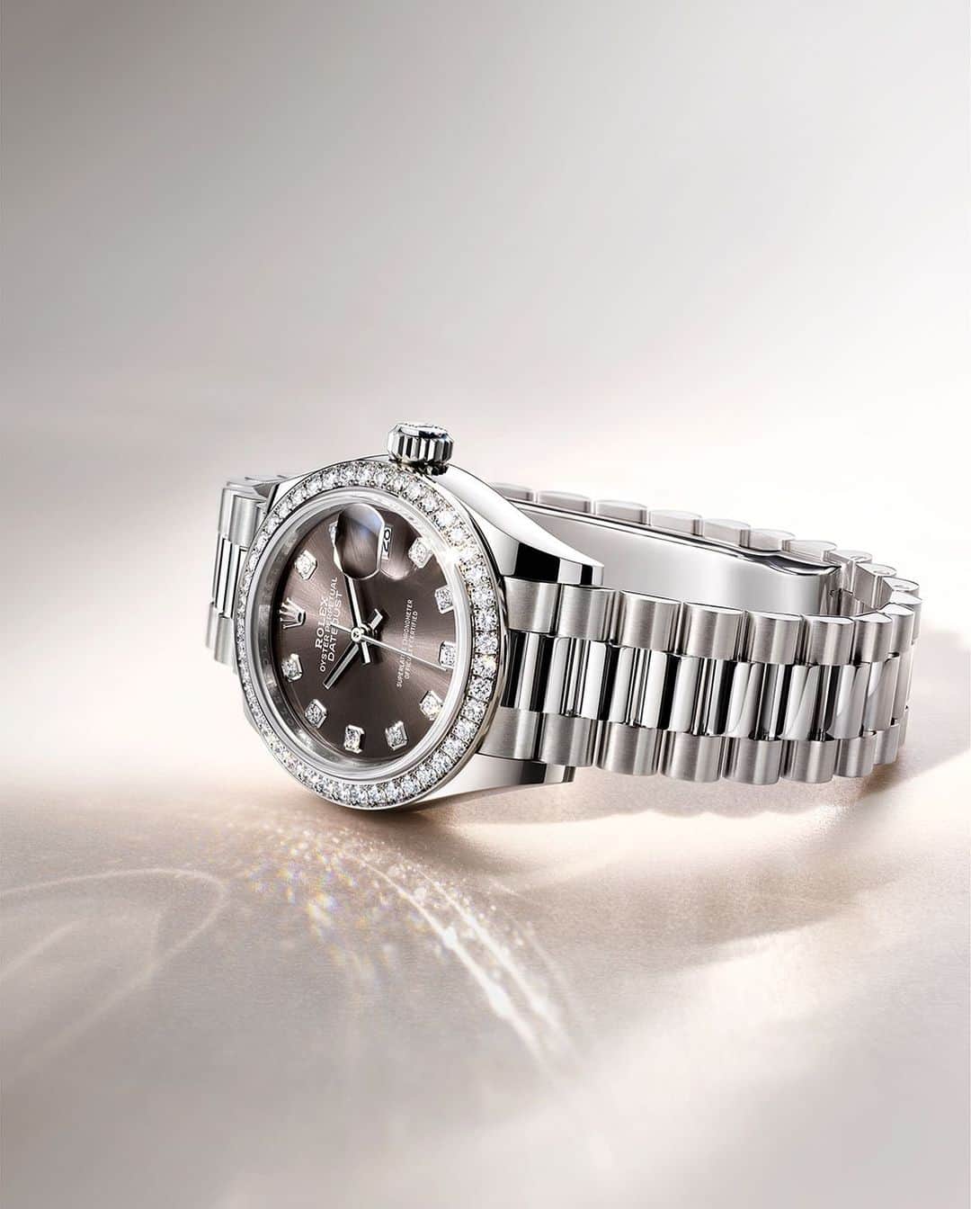 rolexのインスタグラム：「The Lady-Datejust in 18ct white gold with a dark grey dial, diamond-set bezel and President bracelet. Exemplifying the Swiss tradition of “bienfacture”. Fine workmanship that translates into beauty and is reflected in the timepiece's perfect shine. #Rolex #LadyDatejust #101031」
