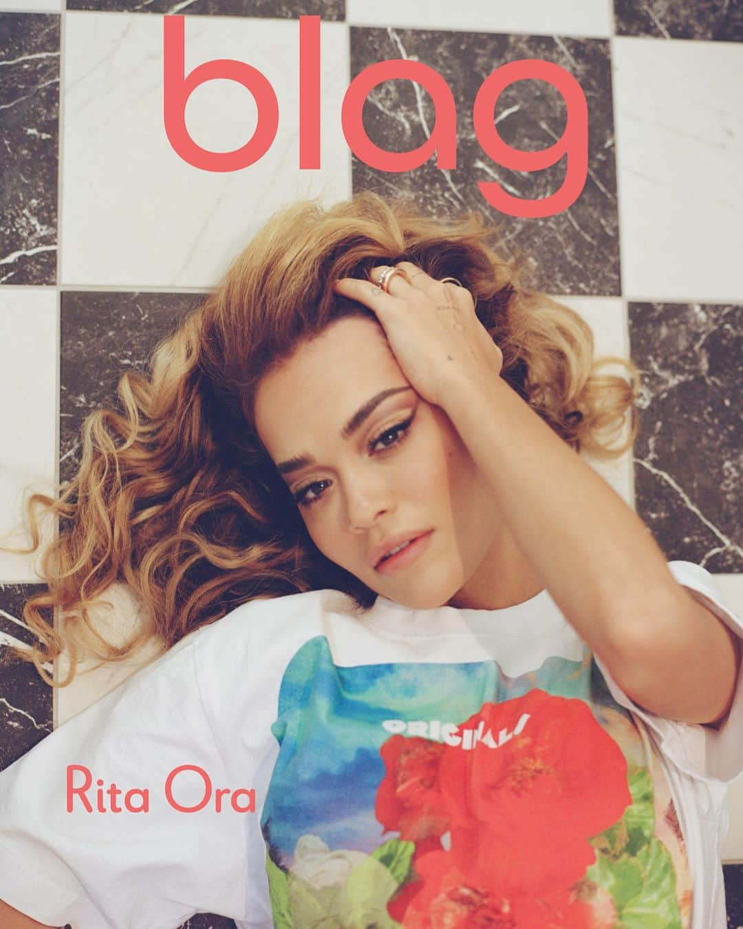 リタ・オラのインスタグラム：「Rita Ora graces the covers of the relaunch edition of the BLAG magazine. In November 2023, BLAG owners, British twins Sally and Sarah return after a long road of rehabilitation from a major accident.   Back to creative duties, the duo begin with the magazine relaunch collaborating with Rita Ora for an original cover shoot and interview.   When Rita heard about the accident, recovery and relaunch she immediately wanted to support Sally and Sarah. She invited them to her home to create a beautiful portfolio shoot. The accompanying interview is a light-hearted and inspiring, creative conversation filled with delights — unlike any interview Rita has done before.   Rita features on two covers wearing BLAG’s Romance and Sci-Fi t-shirts designed by Sally. The feature runs over 30 pages.   The magazine is available to pre-order now in hardcover collectors edition or paperback from  http://www.blag.london」