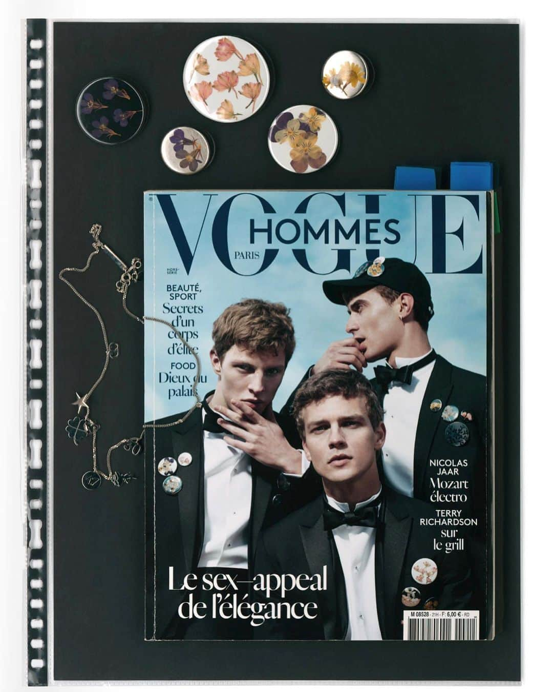 クリスヴァンアッシュのインスタグラム：「KRIS VAN ASSCHE - 55 COLLECTIONS, p. 306 - 307  VOGUE HOMMES SS15 COVER AND EDITORIAL PHOTOGRAPHED BY WILLY VANDERPERRE, WITH DIOR FW15.  REAL, DRIED FLOWER PINS FOR DIOR FW15.   ART DIRECTION @mmparisdotcom  PUBLISHER @lannoopublishers   Link in bio  #krisvanassche #kris_van_assche」