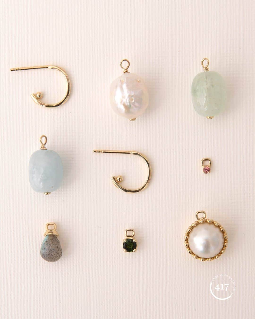 カレ ジュエリーのインスタグラム：「Holiday season 2023. Buy now or add to your wishlist on Ønskeskyen.dk directly from our webshop. 10-karat hoops and charms set with real gemstones.    #earrings #earring #pendants #carre #gemstonejewellery #gemstones #carrejewellery #jewelry」