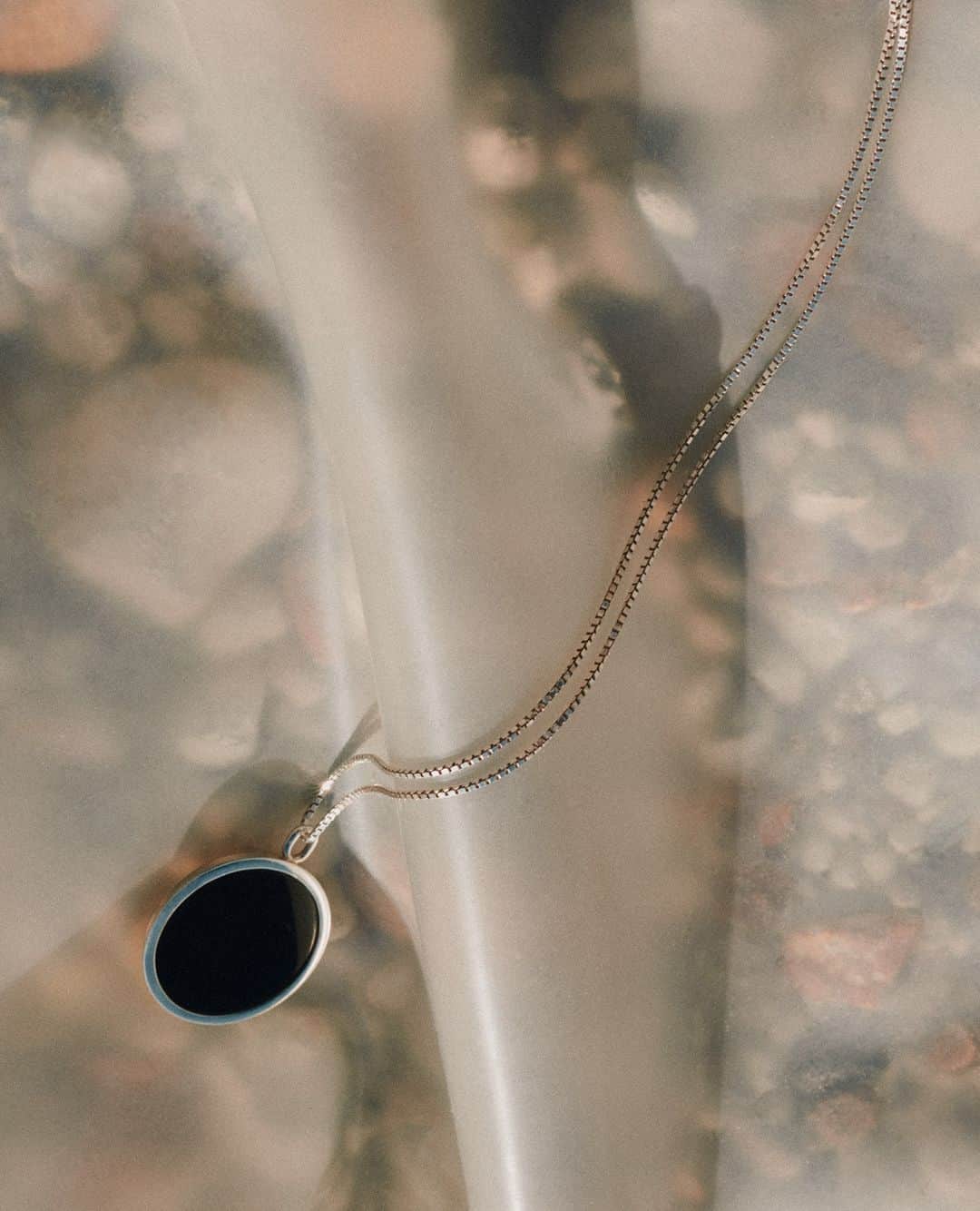 エステルデヴェのインスタグラム：「The "Nouveau Réalisme" necklace in sterling silver and black onyx, photographed by Lisa Jahovic @lisa_jahovic, as part of our "Carte Blanche" series.」