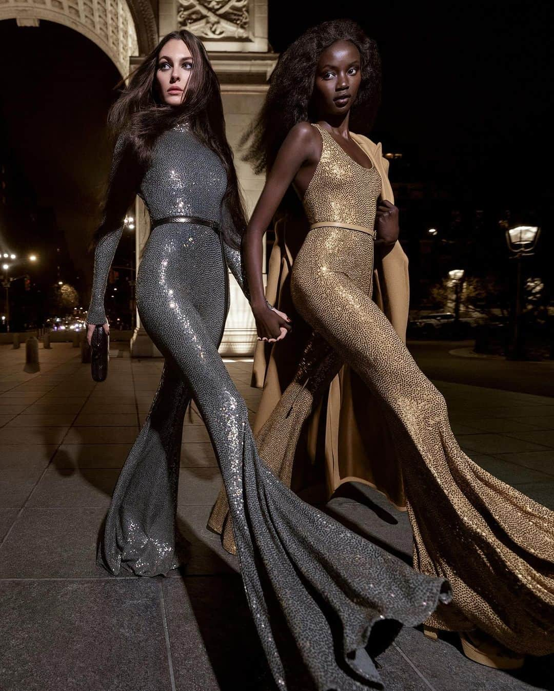 マイケルコースのインスタグラム：「The splendor of hand-embroidered sequins meets the ease of a jumpsuit for a new take on after-dark style. Made in Italy.  Vittoria and Anok wear Looks 59 and 64 from the Fall/Winter 2023 #MichaelKorsCollection runway.   Shot by renowned duo @InezandVinoodh.」