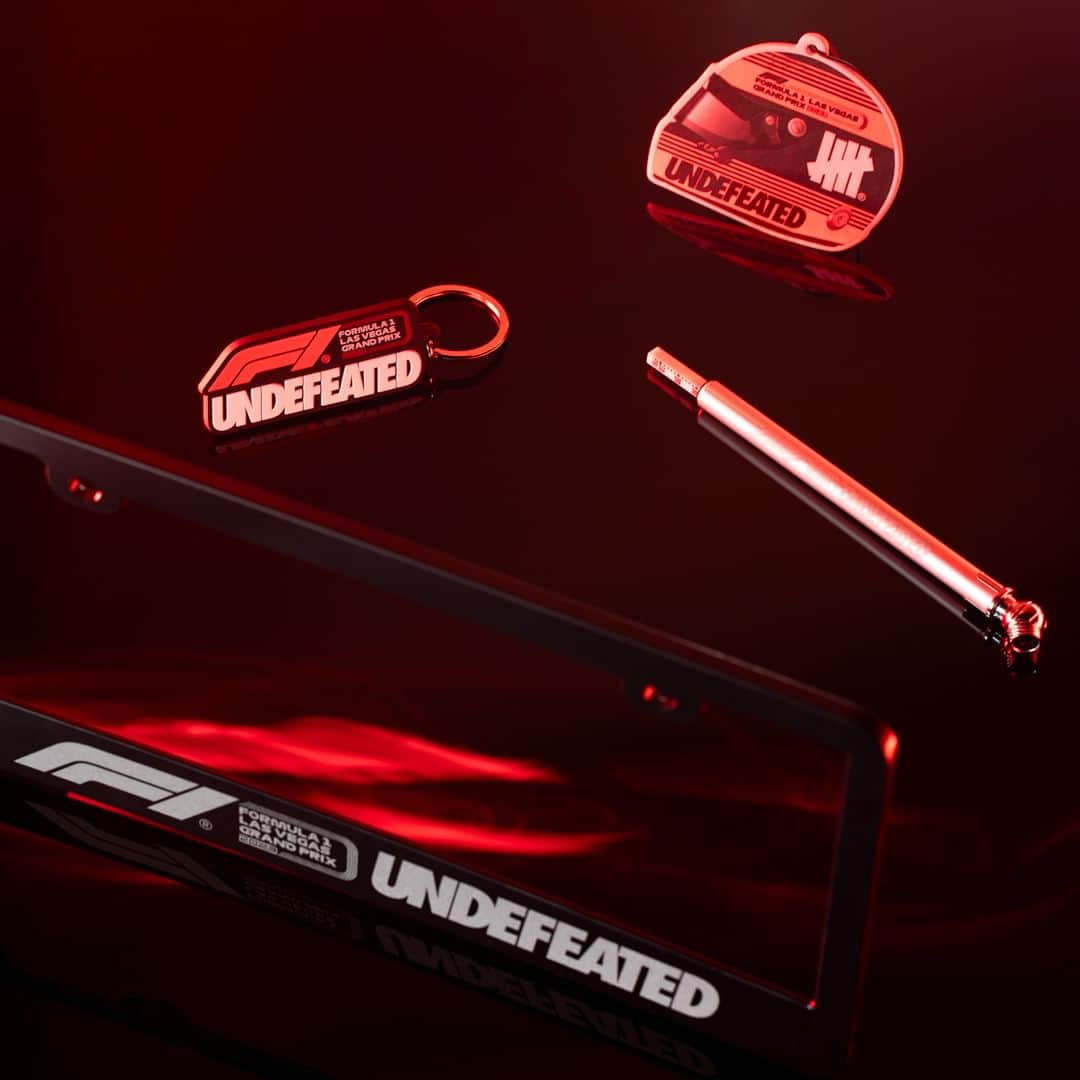 UNDFTDのインスタグラム：「UNDEFEATED x Formula 1 Las Vegas Grand Prix  The UNDEFEATED x F1 LVGP Raised Rubber Keychain, Logo License Plate Frame, Helmet Car Freshener, and Tire Gauge.  The Raised Rubber Keychain is a soft PVC keychain with a 2-D effect and a printed UNDEFEATED x F1 logo lockup. The Logo License Plate Frame is a UV-treated, plastic license plate frame with a screen-printed UNDEFEATED x F1 logo lockup. The Helmet Car Freshener is a cardstock car freshener with printed UNDEFEATED and F1 logos on race helmet. The Tire Gauge is an aluminum tire gauge with a laser-etched UNDEFEATED x F1 logo lockup.  Available Monday, 11/13, at 11am at all UNDEFEATED Chapter Stores and 8am PST at Undefeated.com」