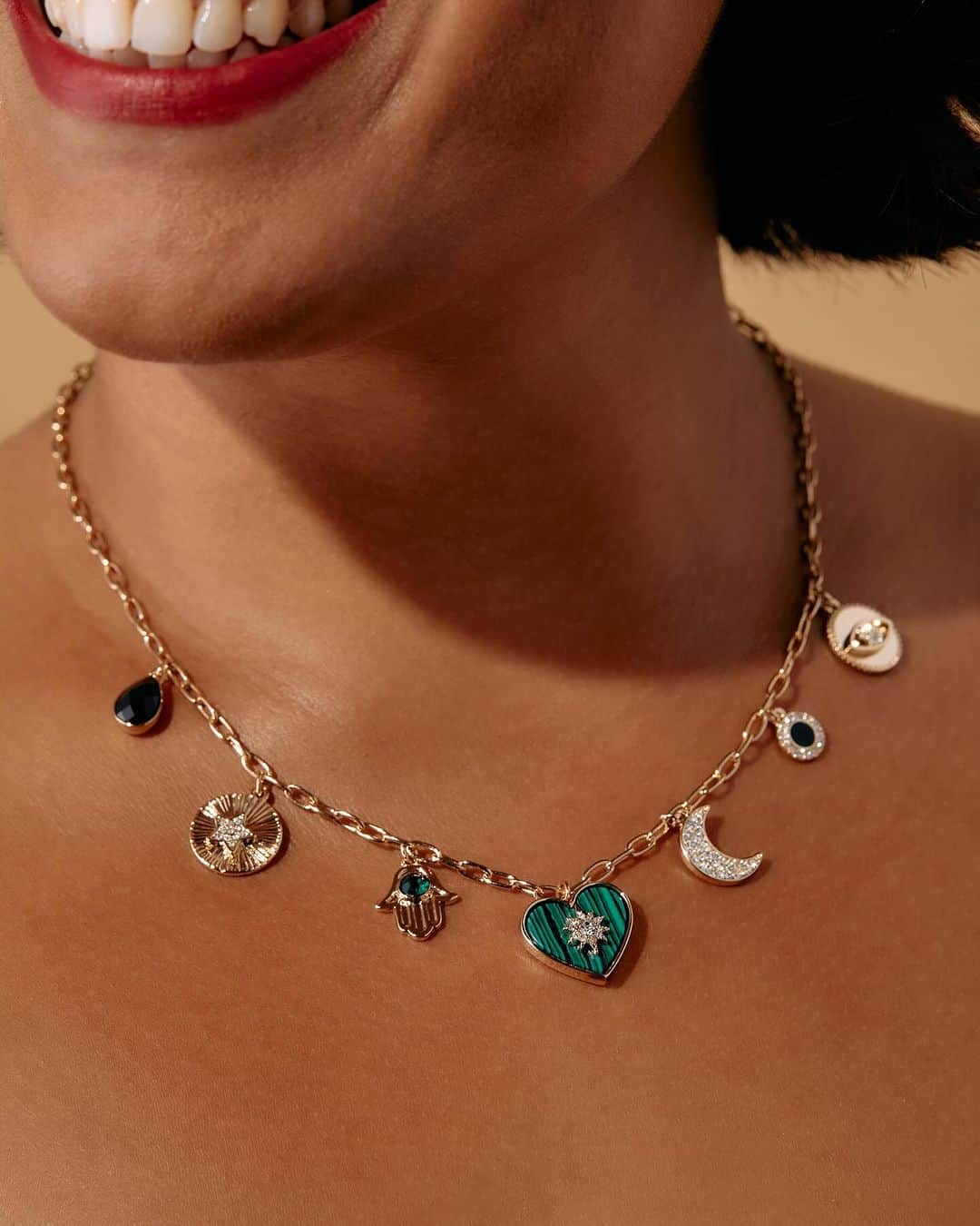 アレックスアンドアニのインスタグラム：「Charm necklaces are having their MOMENT right now and you can embrace this trend with our new Positive Vibes Charm Necklace 🪬  This adjustable-length chain link necklace features an evil eye and a hamsa for protection against negative energy, a moon and star for guidance and encouragement to trust your intuition, and a heart to remind you to stay open and lead with love. What more could you ask for? 🤩  Shop the Positive Vibes Charm Necklace on our website for 40% off via our Black Friday Preview Sale happening NOW! #charmnecklace #alexandani #charms #charmbracelet」