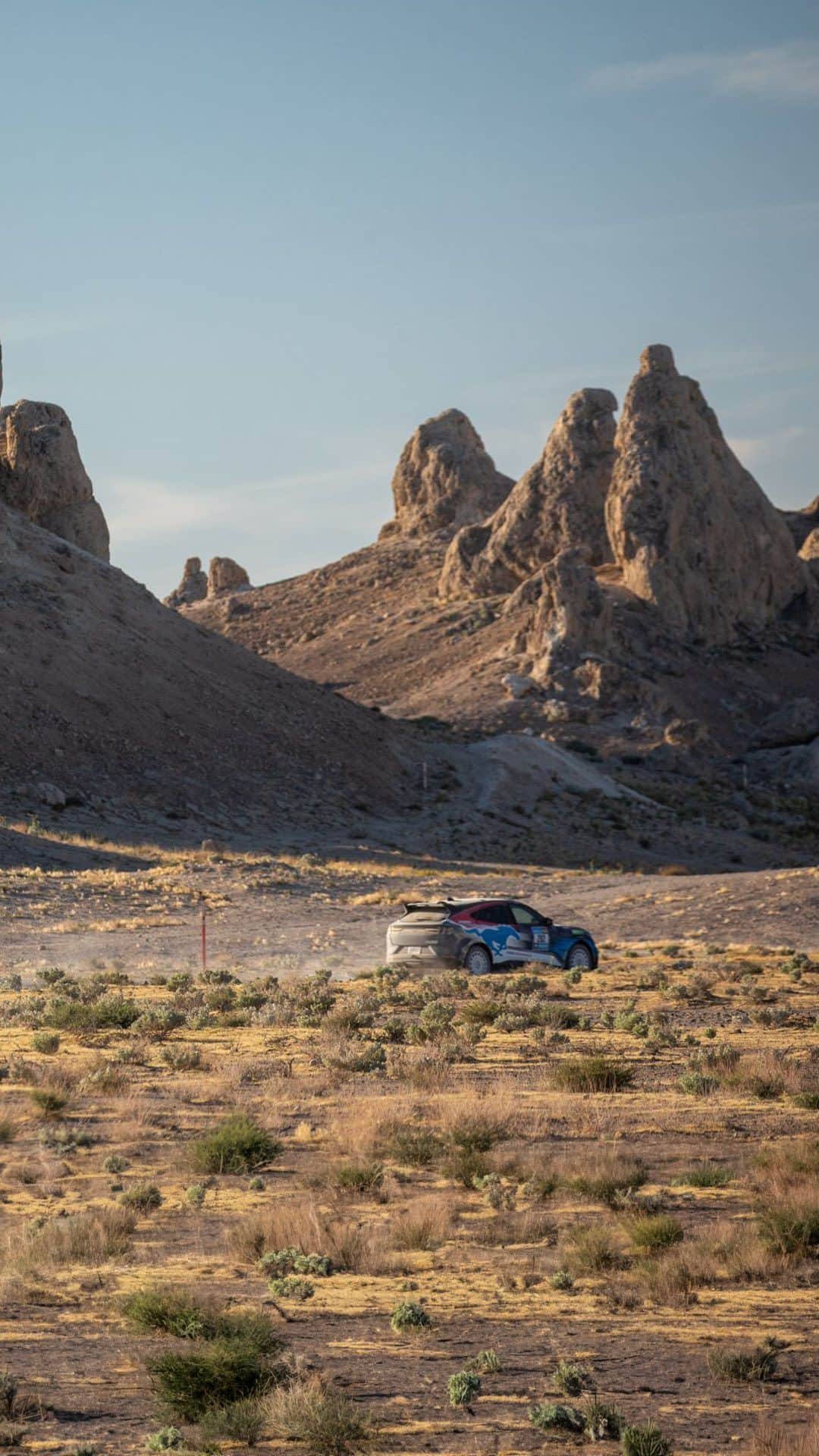 Fordのインスタグラム：「“The Rebelle Rally demonstrates the capabilities, durability and agility of our vehicles, including serving as a test bed for the Mustang Mach-E® Rally.” —Mark Rushbrook, Global Director, Ford Performance Motorsports   Disclaimer: Optional and aftermarket equipment shown. Professional driver on a closed course. Always consult the owner’s manual before off-road driving, know your terrain and trail difficulty, and use appropriate safety gear. Custom wrap shown. Not for sale.」