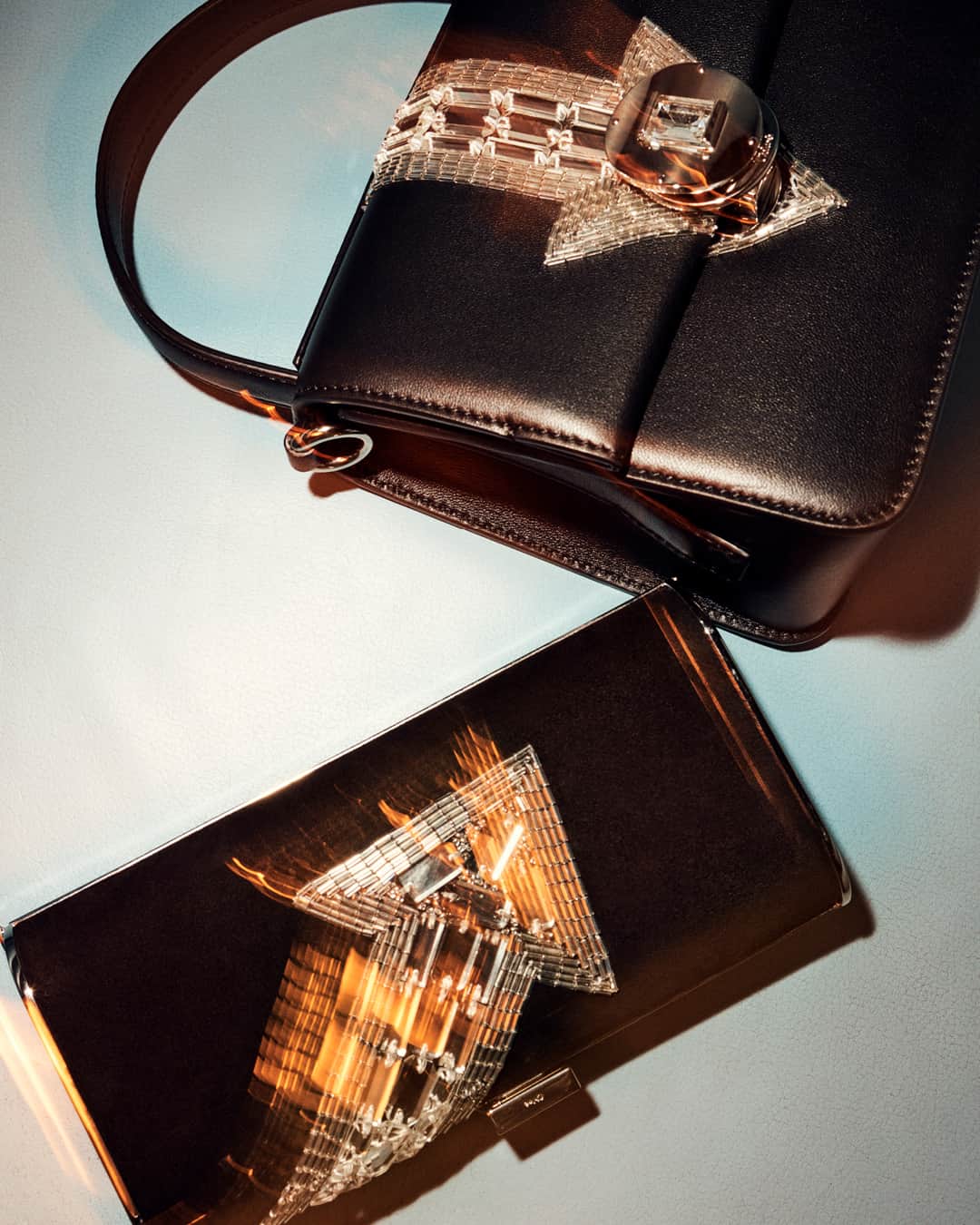 Chloéのインスタグラム：「The crystal arrow motif that darts across the limited-edition black leather Penelope top-handle bag and rectangular clutch is made using traditional embroidery techniques – each design requires between 15 and 20 hours of specialist handwork.」