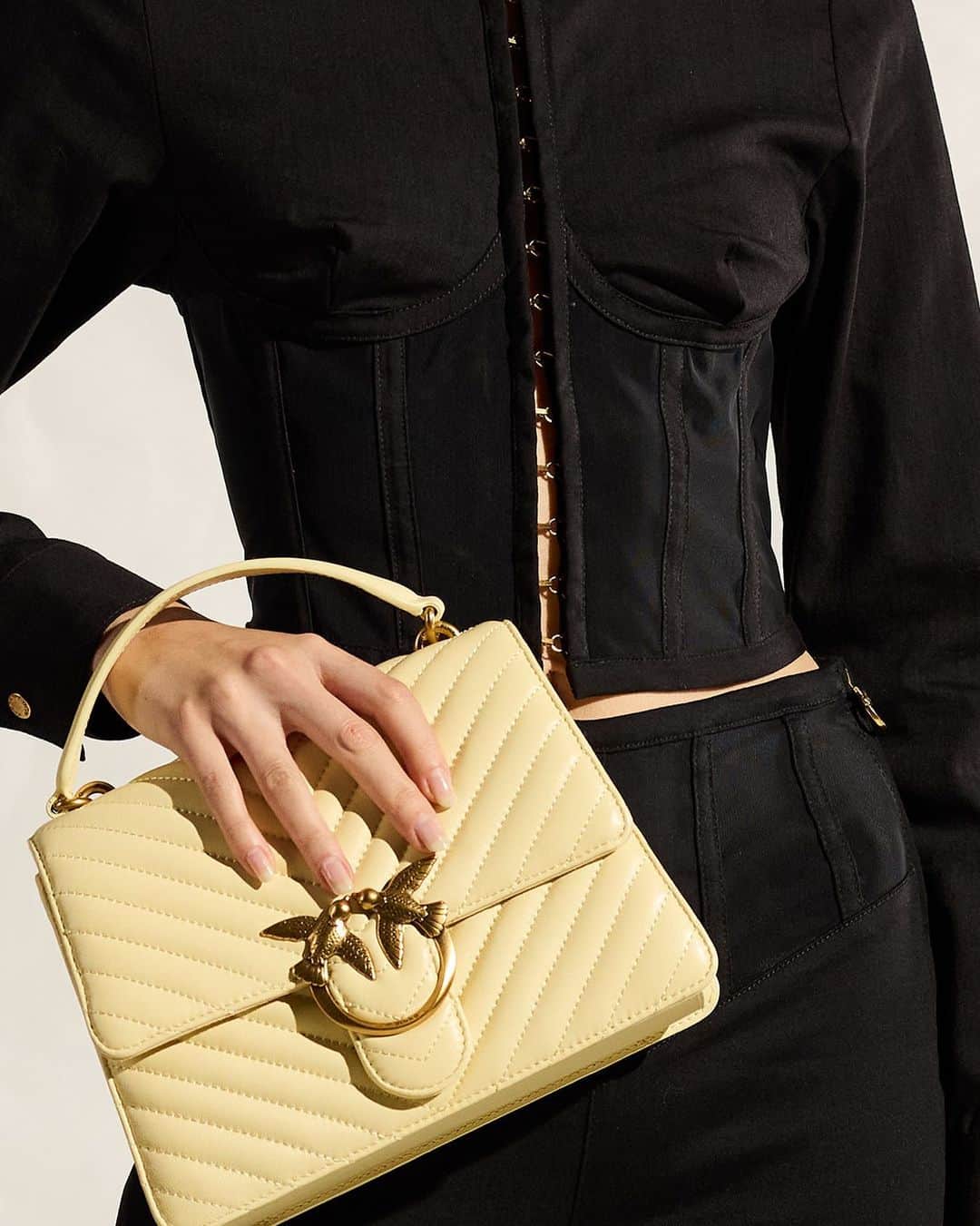 のインスタグラム：「We’re currently obsessed with two things: corsets and the #LoveBag! #PINKO #FW23」