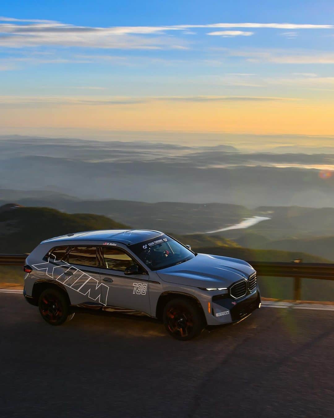 BMWのインスタグラム：「Thrilled to be named fastest hybrid SUV at the Pikes Peak. ⛰️ The BMW XM Label sets a new record for Hybrid Electric SUVs at Pikes Peak. Reaching the summit in 10:48:60.  The BMW XM Label. #BMWXM #BMW #BMWM #MHybrid #MPower  __ BMW XM Label: Combined fuel consumption, weighted: 2.0–1.6 l/100 km. Combined power consumption, weighted: 33.5–32.5 kWh/100 km. Combined CO2 emissions, weighted: 45–35 g/km. Electric range: 76-82 km. All data according to WLTP.  Further info: www.bmw.com/disclaimer」
