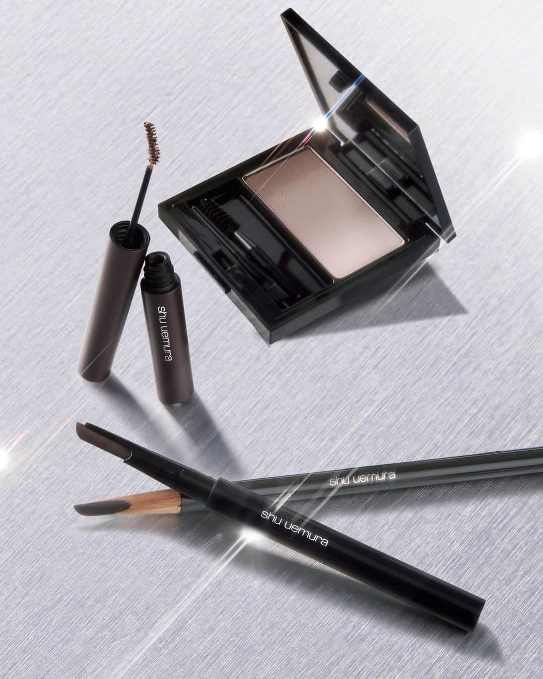 シュウウエムラのインスタグラム：「warm or cool undertones, we've got you covered. 🔥precisely draw and define natural brows in 3.👇   1️⃣: shade with brow shader in warm or cool for natural dimension⁠ 2️⃣: for sharper-defined brows, fill with #hardformula.  for a softer definition, fill with brow sword naginata⁠ 3️⃣: color and lift with kushi brow⁠ ⁠ ウォームまたはクールどちらを使う？🔥抜け感のあるナチュラルな眉を３つのアイテムで創りだす。⁠👇 ⁠ 1️⃣: ブローシェーダーを使ってナチュラルな立体眉を作る⁠ 2️⃣: よりシャープな眉に仕上げたい場合は、#ハードフォーミュラで、よりソフトな眉に仕上げたい場合は、ブロースウォードナギナタを使う⁠ 3️⃣: クシブローで色をつける⁠ ⁠ #shuuemura #シュウウエムラ⁠ #3Dbrowexpert ⁠ #naturalbrows #browmakeup」