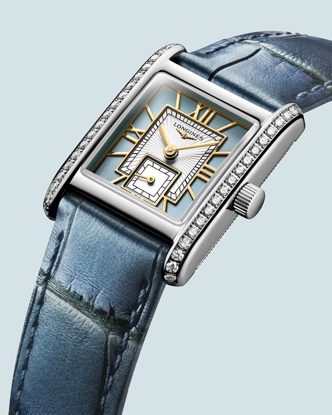 ロンジンのインスタグラム：「The MINI DOLCEVITA, a true icon in #SereneBlue.  Discover the collection via the link in bio.   #Eleganceisanattitude #MiniDolceVita #LonginesDolceVita」
