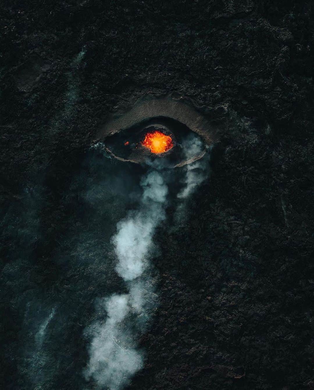 Discover Earthのインスタグラム：「🌋👁️ Iceland's dragon eye view. Witnessing the fiery gaze of Mother Nature from above!  📍 Iceland  🇮🇸 #DiscoverIceland with @gunnargunnar」