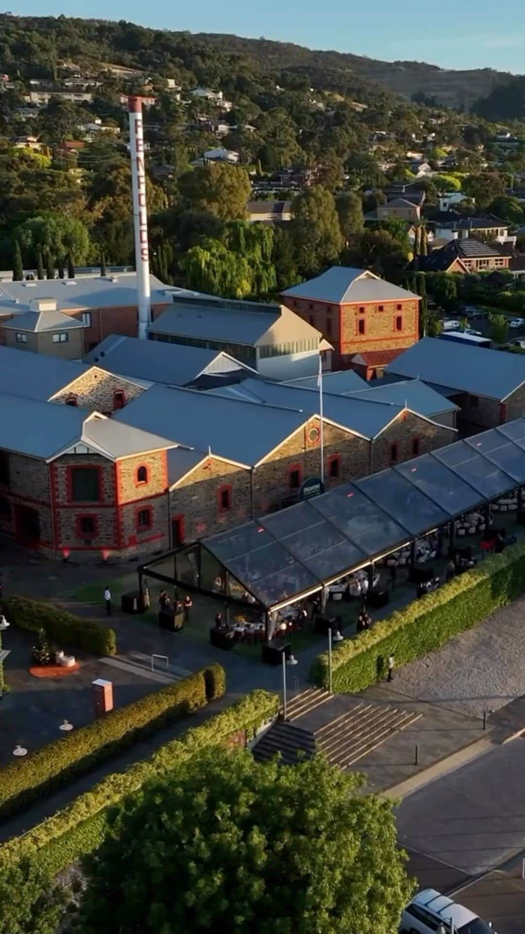 Australiaのインスタグラム：「Now, THIS is what dreams are made of! ☁️💫 Hosted by Business Events Australia, the #Dreamtime2023 dinner took place on the lawns at @penfolds Magill Estate - just 20 minutes from Tarntanya (@cityofadelaide). The event saw 260 guests seated at an endless table which wound its way across the lush grounds. Table centrepieces featured collections of native seed pods and emu feathers sustainably sourced specifically for Dreamtime by Indigenous families on Traditional Lands, while the dishes showcased local ingredients like @southaustralia oysters and Port Lincoln tuna paired with delicious #Penfolds wines.   📍: Penfolds Magill Estate, #Adelaide, #SouthAustralia   #ComeAndSayGday #SeeAustralia #Dreamtime2023 #MeetInAus #SeeSouthAustralia  ID: An aerial view of a clear marquee with a long table winding its way from end to end of the marquee, with vineyards, buildings and hills in the backdrop. The light changes from late afternoon to dusk, to night time.」