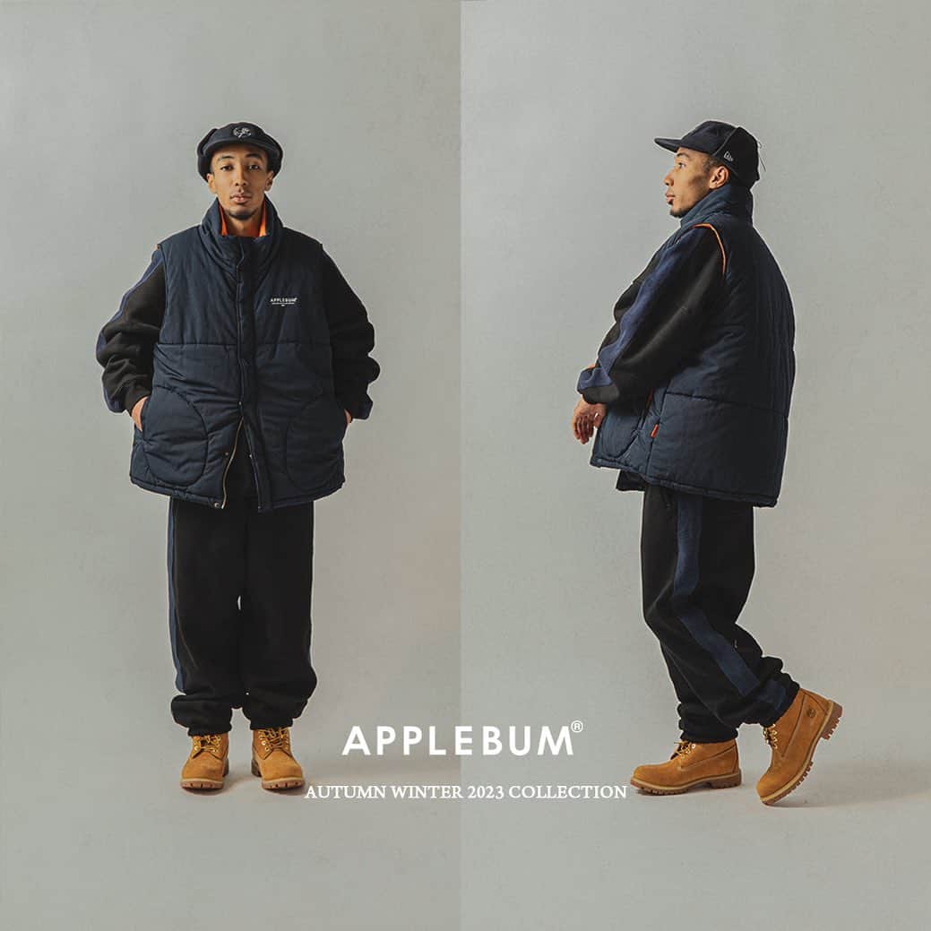 アップルバムのインスタグラム：「Black&Navy Street Style リブ素材で切り返したスウェットとゆとりのあるパターンのベストであわせたスタイリング。 統一感のある色合いの中に、ベストの裏地・ピスネームのオレンジカラーや、胸元のワンポイントロゴが程よいアクセントに。 動きやすくリラックス感のあるストリートスタイルで、寒くなり始めたこの時期をお楽しみください。  #applebum #setup」