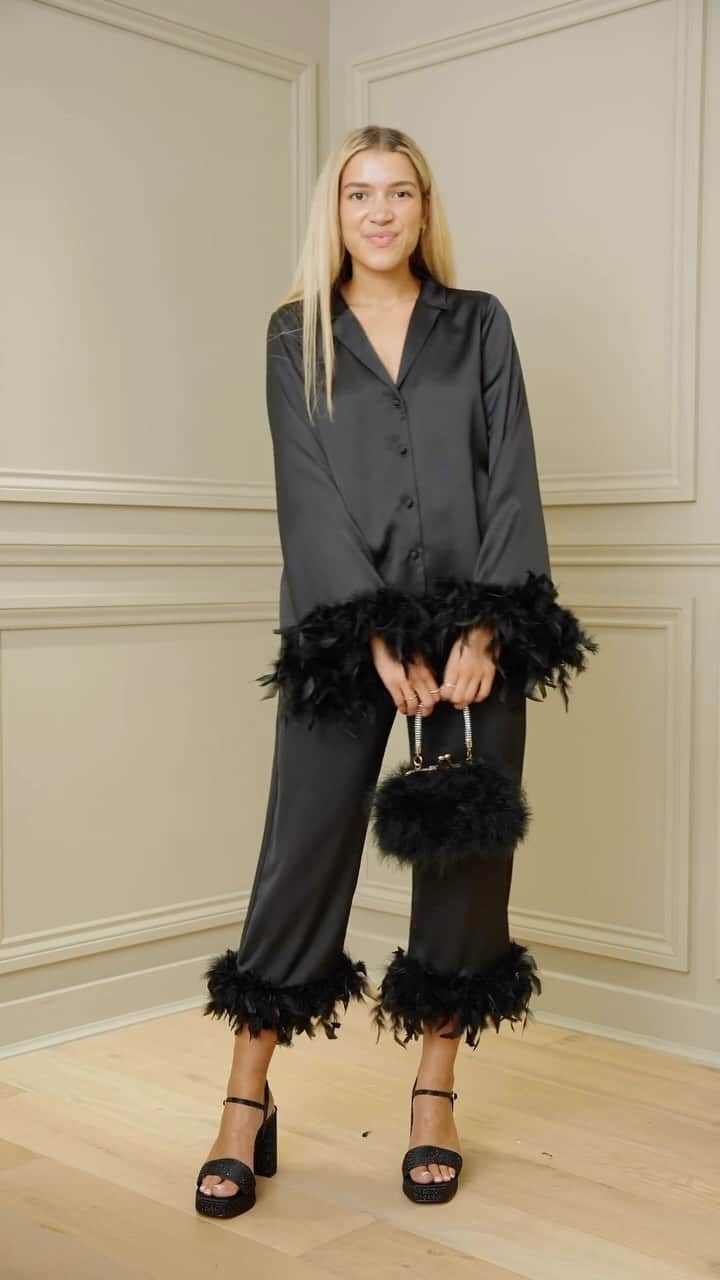 River Islandのインスタグラム：「The perfect plumes to party in.  #ImWearingRI #Linkinbio to shop  Black feather cuff shirt - 904056 Black satin feather trousers - 904781 Black diamante heeled sandals 750945 Black embossed shoulder bag - 902025​」