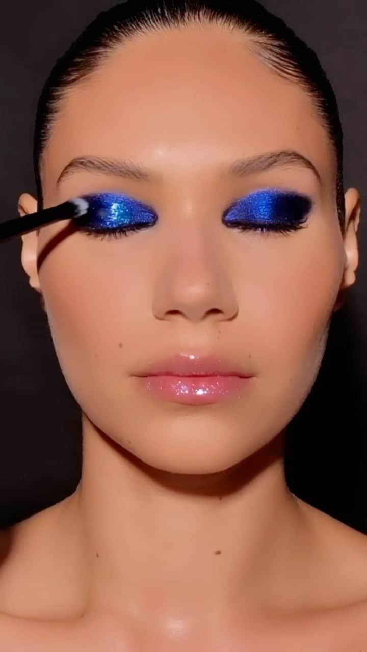 パット・マグラスのインスタグラム：「GLOSSY GORGEOUSNESS ⚡⚡⚡ #patmcgrathlabs presents the majestic blend of DARK STAR 006 V4: BLITZ SAPPHIRE, perfected on the stunning #McGrathMuse @cindy_gradilla #PairedByPat with LUST: Gloss™ in ‘ASTRAL MOON FLOWER’ for seductive sparkle. ⚡⚡⚡ #TurnYourEyesOn - EXCLUSIVELY at PATMcGRATH.COM  💙STARRING💙 DARK STAR 006 V4 Blitz Sapphire Eye Shadow (Blackened Sapphire with Bright Blue Sparkling Pearls) Cyber Electric Eye Gloss (Translucent with Cerulean Sparkling Pearls) LUST: Gloss™ ‘ASTRAL MOON FLOWER’ - Periwinkle Blue with Iridescent Pearl」