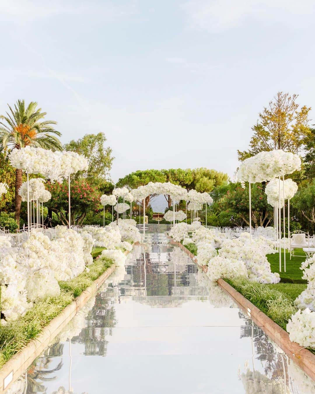 Ceci Johnsonさんのインスタグラム写真 - (Ceci JohnsonInstagram)「WEDDING | S&A’s wedding day unfolded like a dream, resembling a white cloud flower fantasy. In harmony with the theme, we designed the napkins, menu, and invitation page in a palette of white and silver. The invitation itself showcased their wedding day florals, transitioning guests from paper to reality. For the reception, we crafted a menu featuring a silver mirror laser-cut border surrounding a white acrylic center, drawing inspiration from French brocade patterns. Complementing this, silver-embroidered napkins adorned with their monogram added the perfect finishing touch.  #CeciCouture ⠀⠀⠀⠀⠀⠀⠀⠀⠀ CREATIVE PARTNERS Planning & Design: @lavenderandroseweddings Luxury Invitation & Event Branding: @cecinewyork Venue & Catering:  @fscapferrat Cake: @bastien_blanc_tailleur Photography: @daniloandsharon Videography: @chromata_films_weddings Production: @deco_flamme Tableware: @latinidesign @maison_options Floral Design: @roni_floral_design Music:  @qart.events @alexandramillerinsta @adilmaksutovic @cecaraznatovic @cobi.v Entertainment: @nuart_events @prodiammclescure @pyrokervenka @blackbirdcage @houseofpyramid ⠀⠀⠀⠀⠀⠀⠀⠀⠀ #cecinewyork #ceciwedding #lavenderandroseweddings #luxuryinvitations #elegantdesigns #coutureinvites #opulentdetails #bespokeinvitations #chiccelebrations #artistryininvitations #highenddesigns #luxurystationery #premiuminvitations #exquisitedetails #invitationelegance #celebrateinstyle #glamorousinvites #luxurycelebrations #finestationery #customizedelegance #celebrationperfection #invitationcouture #elevateyourevent #luxuryeventplanning #unforgettableinvites」11月15日 23時48分 - cecinewyork