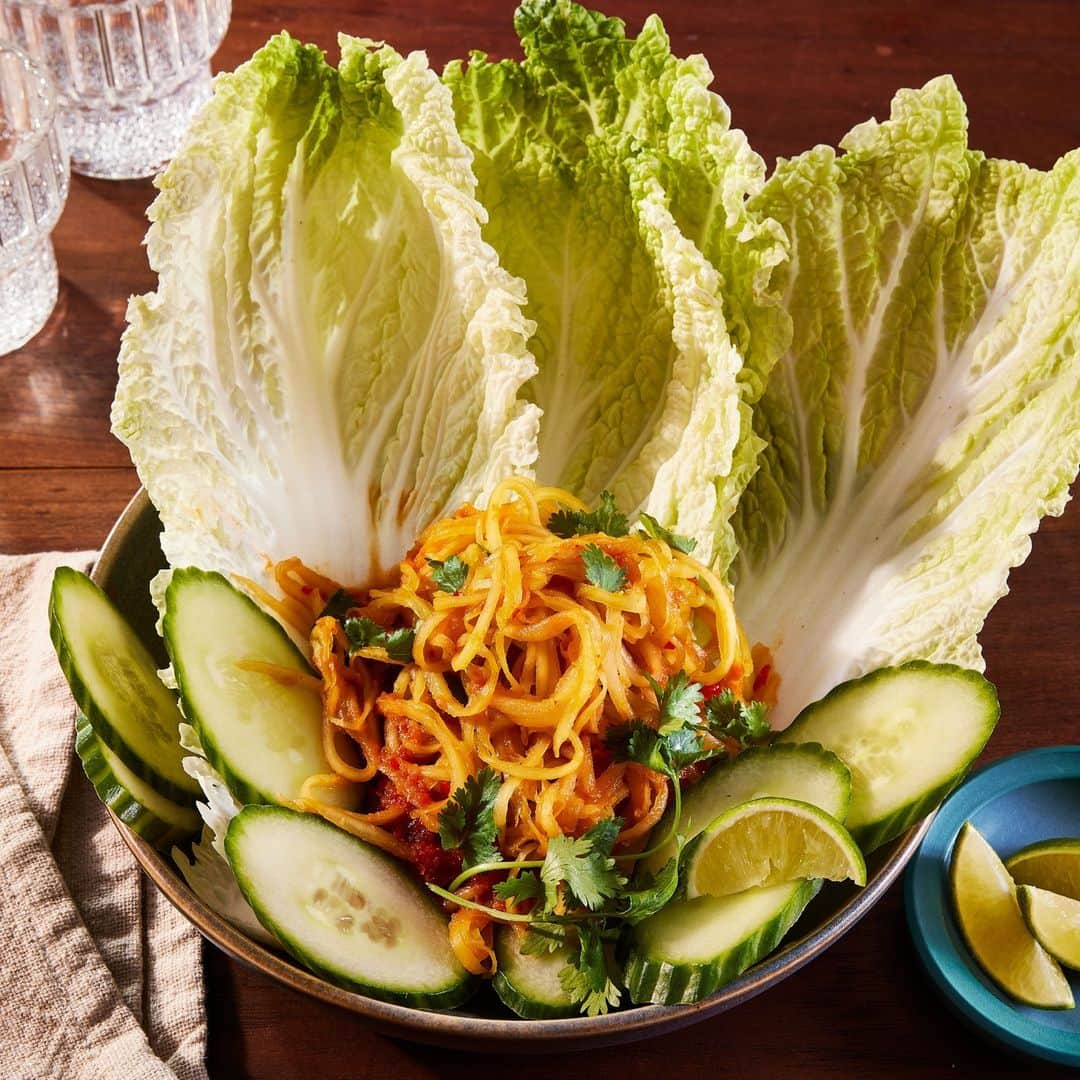 Food & Wineのインスタグラム：「If you're looking for something a little lighter to counteract *everything else* going on this food-heavy season, this Bok Lahong (Cambodian Green Papaya Salad) is just the thing. Crisp green papaya, cucumber, and cabbage are the canvas for an umami-rich caramelized fish sauce dressing that truly shines. Try it out at the link in bio.   🥗: @girlslanteee, 📸: @jencausey, 🥄: @tourblvd, 🍽: @shellroyster」