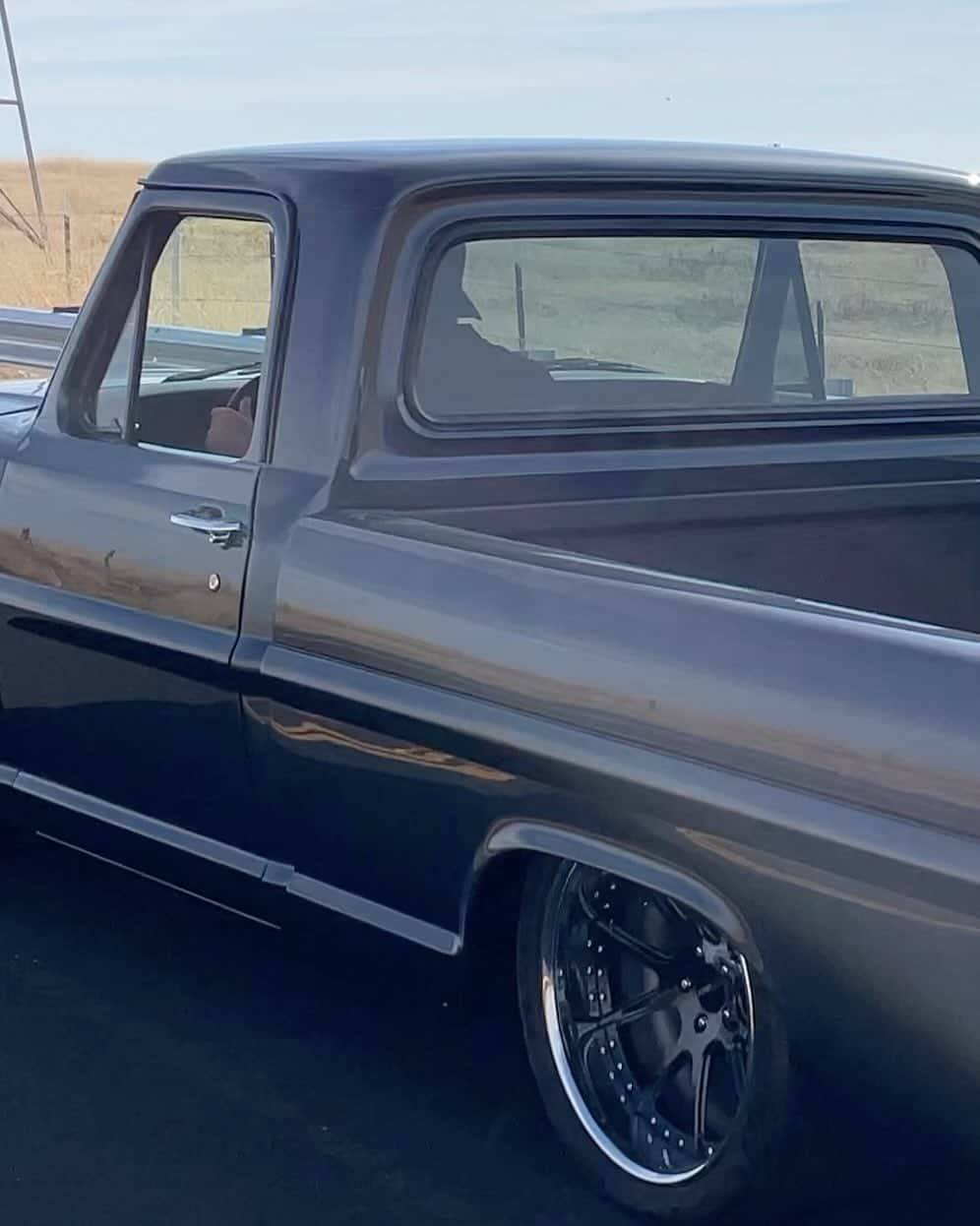 Classics Dailyのインスタグラム：「Live on @BringATrailer!  NO RESERVE!!! @gtautolounge is pleased to present this stunning 1969 Ford F-100 Restomod that was acquired by the current owner in 2018 and underwent a 4 year restoration. The 5.0-liter Gen II Coyote V8 is equipped with a Whipple supercharger producing 800whp and power is sent to the rear wheels via a six-speed 6R80 automatic transmission and an 8.8″ rear axle with a Detroit TrueTrac differential. Additional modifications include an X4 ECU tuner with E85 flex-fuel capability, a dual exhaust system, 20″ Forgeline wheels, CPP Mustang II independent front suspension with tubular control arms, a RideTech triangulated four-link rear suspension setup, hydroboost rack-and-pinion steering, Viking double-adjustable coilovers, and four-wheel disc brakes. The body was repainted metallic gray and fitted with a rollpan, wheel tubs, and front and rear spoilers, while the cabin was refurbished with a leather-trimmed TMI bench seat, a Lecarra four-spoke steering wheel, Dakota Digital instrumentation, a Vapir 3 climate control system, a touchscreen Sony head unit, Alpine door speakers, and power windows and door locks. This modified bumpside F-100 is offered on dealer consignment with a clean California title in the owner’s name. _ #ford #fordtruck #fordf100 #1969f100 #69f100 #coyotev8 #whipplesupercharger #bringatrailer #protouring #streettruck #classictruck #tmiinterior」