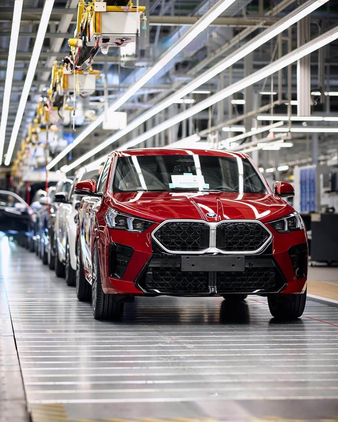 BMWのインスタグラム：「First. 🌶️ The first-ever BMW iX2 got into production few days ago. Welcome to the X family. #THENEWiX2 #BMWiX2 #BMW #BMWi  __ BMW iX2 xDrive30: Combined power consumption: 17.7–16.3 kWh/100 km. Combined CO2 emissions: 0 g/km. Electric range: 417–449 kilometers. All data according to WLTP.  Further info: www.bmw.com/disclaimer」