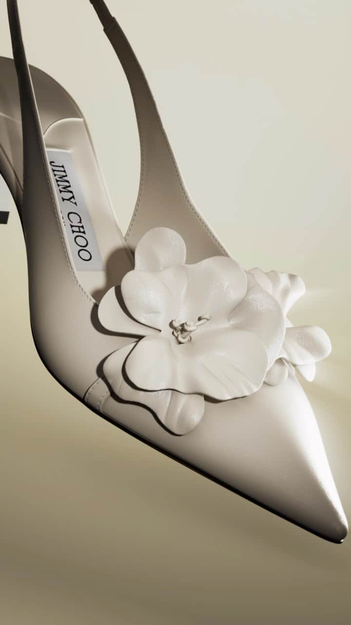 Jimmy Chooのインスタグラム：「Winter 2023 represents a new era for Amita, the classic sling back blossoms with the addition of handcrafted leather orchids #JimmyChoo」
